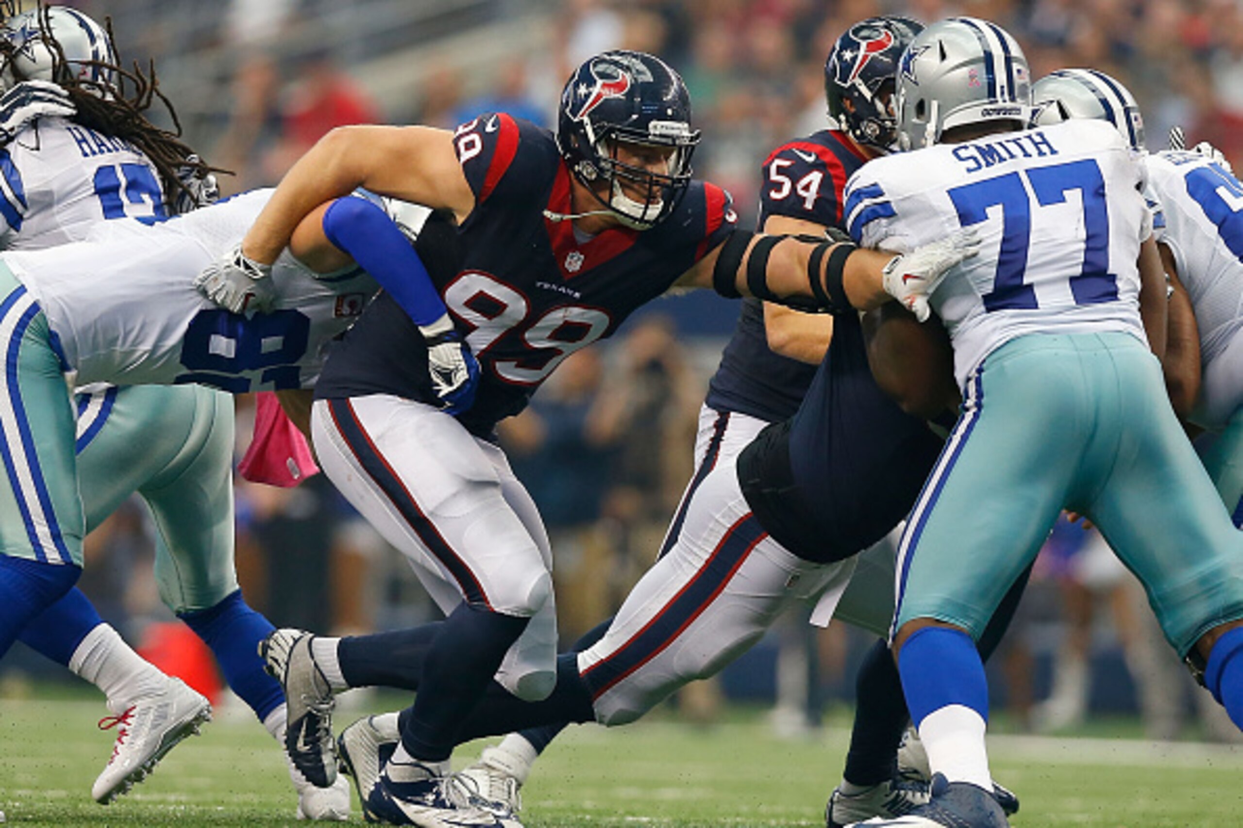 ARLINGTON, TX - OCTOBER 05:  J.J. Watt #99 of the Houston Texans breaks through the line of scrimmage against the Dallas Cowboys in the second half at AT&T Stadium on October 5, 2014 in Arlington, Texas.  (Photo by Tom Pennington/Getty Images)