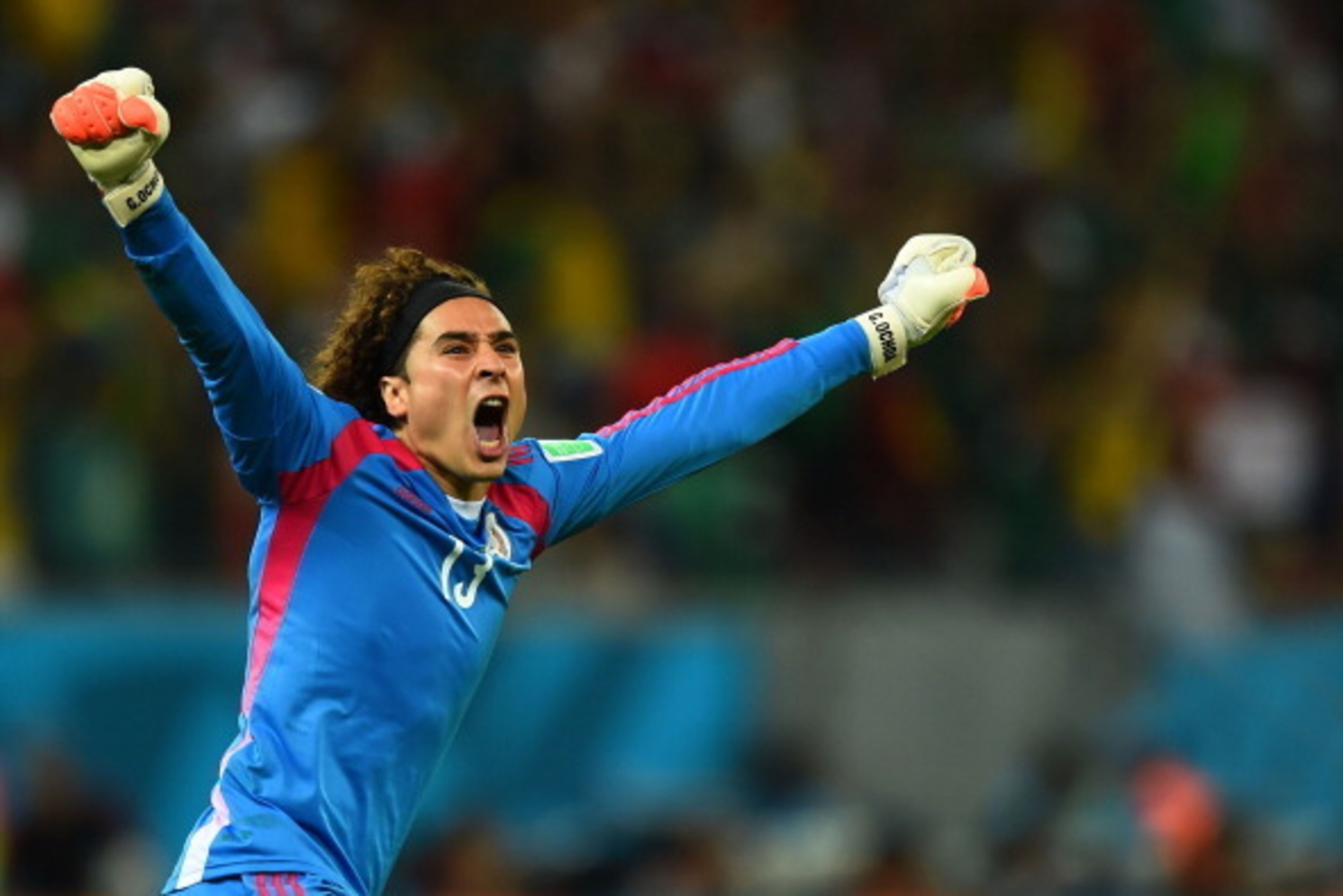 RECIFE, BRAZIL - JUNE 23:  Guillermo Ochoa of Mexico celebrates his team's first goal during the 2014 FIFA World Cup Brazil Group A match between Croatia and Mexico at Arena Pernambuco on June 23, 2014 in Recife, Brazil.  (Photo by Jamie McDonald/Getty Im