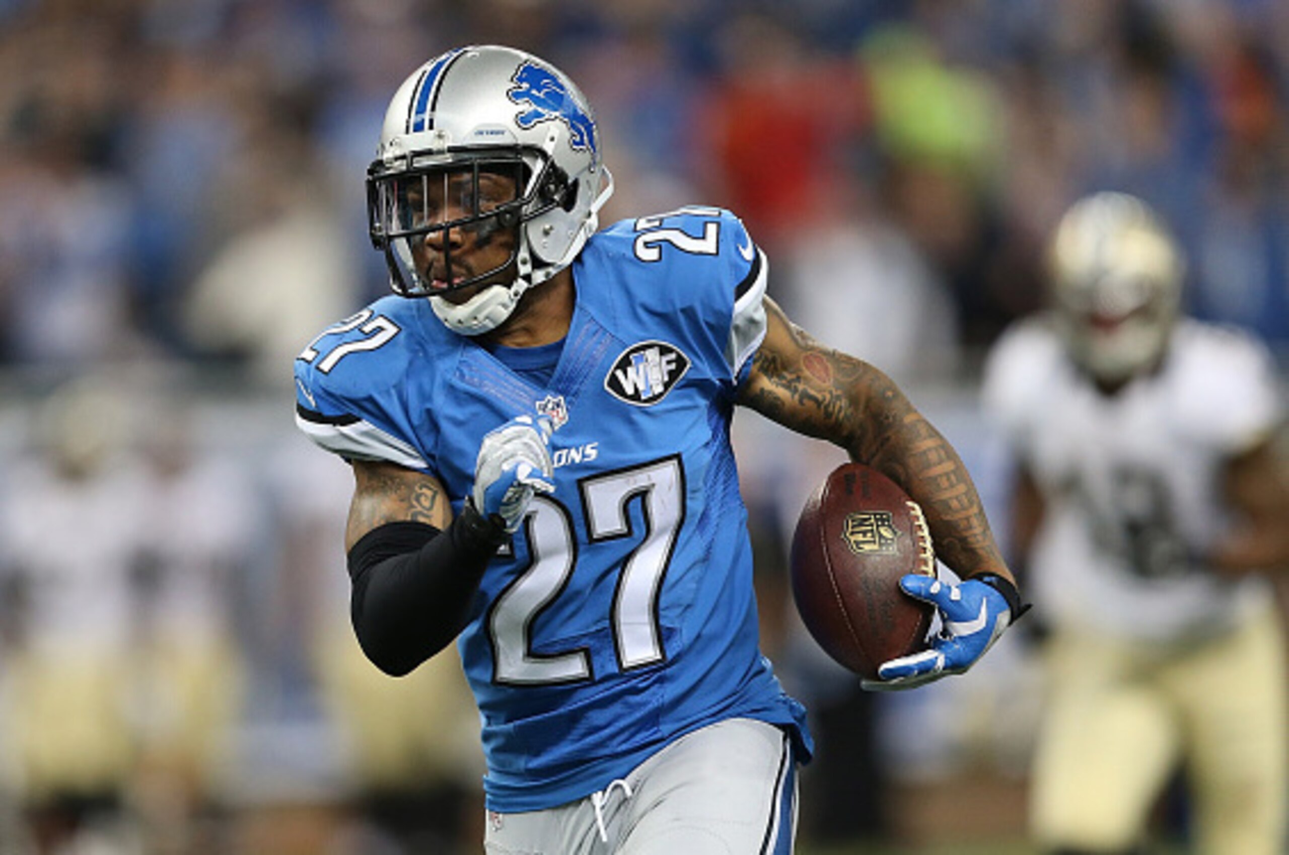 DETROIT, MI - OCTOBER 19:  Glover Quin #27 of the Detroit Lions runs back the fourth quarter interception off Dree Brees (not in photo) during the game at Ford Field on October 19, 2014 in Detroit, Michigan. The Lions defeated the Saints 24-23. (Photo by 