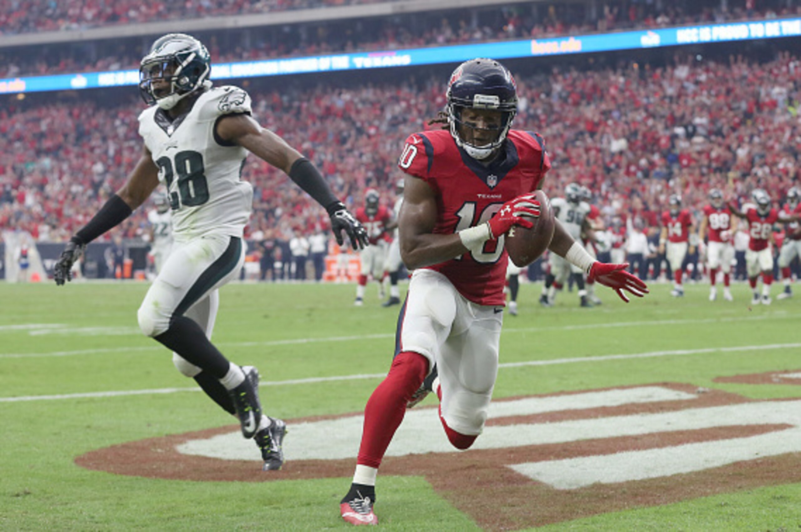 HOUSTON, TX- NOVEMBER 02: DeAndre Hopkins #10 of the Houston Texans scores a touchdown while Earl Wolff #28 of the Philadelphia Eagles covers in the second half in a NFL game on November 2, 2014 at NRG Stadium in Houston, Texas. Eagles won 31 to 21. (Phot