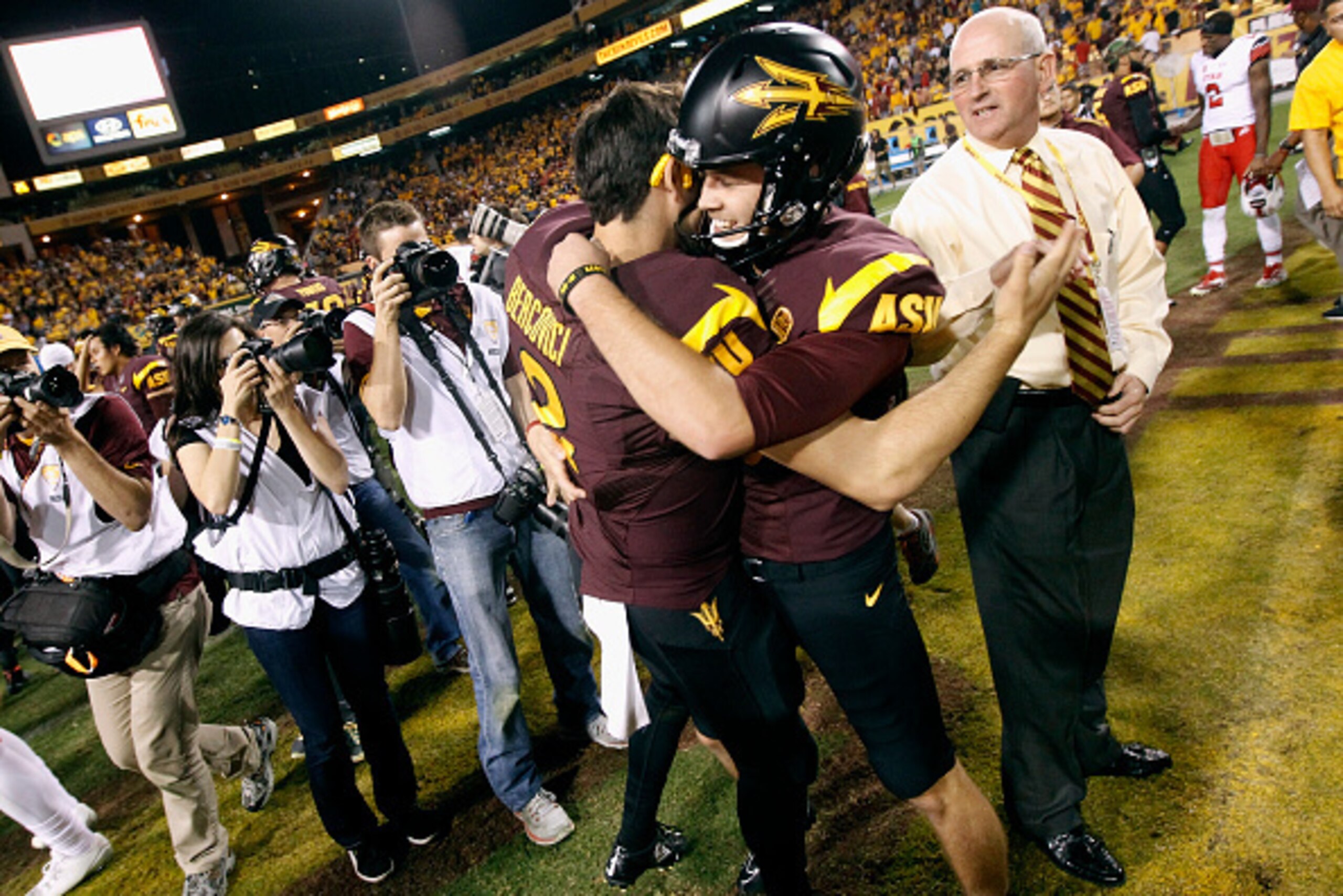 TEMPE, AZ - NOVEMBER 01: Kicker Zane Gonzalez #5, and Mike Bercovici #2 of the Arizona State Sun Devils embrace in celebration after Gonzalez kicked the game winning field goal against the Utah Utes in overtime of a college football game at Sun Devil Sta TEMPE, AZ - NOVEMBER 01: Kicker Zane Gonzalez #5, and Mike Bercovici #2 of the Arizona State Sun Devils embrace in celebration after Gonzalez kicked the game winning field goal against the Utah Utes in overtime of a college football game at Sun Devil Sta