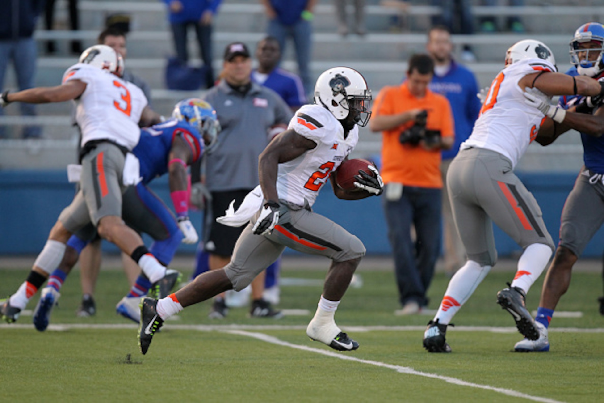 LAWRENCE, KS - OCTOBER 11:  Tyreek Hill #24 of the Oklahoma State Cowboys runs back a kickoff for a touchdown in the fourth quarter against the Kansas Jayhawks at Memorial Stadium on October 11, 2014 in Lawrence, Kansas. Oklahoma State won 27-20. (Photo b