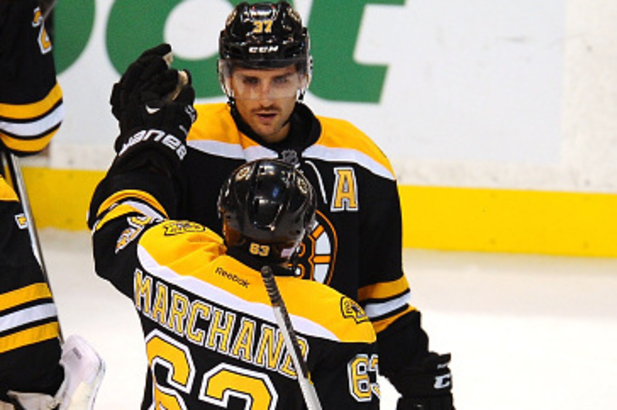 BOSTON, MA - NOVEMBER 4: Patrice Bergeron #37 and Brad Marchand #63 of the Boston Bruins celebrate an overtime win against the Florida Panthers at the TD Garden on November 4, 2014 in Boston, Massachusetts. (Photo by Steve Babineau/NHLI via Getty Images) BOSTON, MA - NOVEMBER 4: Patrice Bergeron #37 and Brad Marchand #63 of the Boston Bruins celebrate an overtime win against the Florida Panthers at the TD Garden on November 4, 2014 in Boston, Massachusetts. (Photo by Steve Babineau/NHLI via Getty Images)