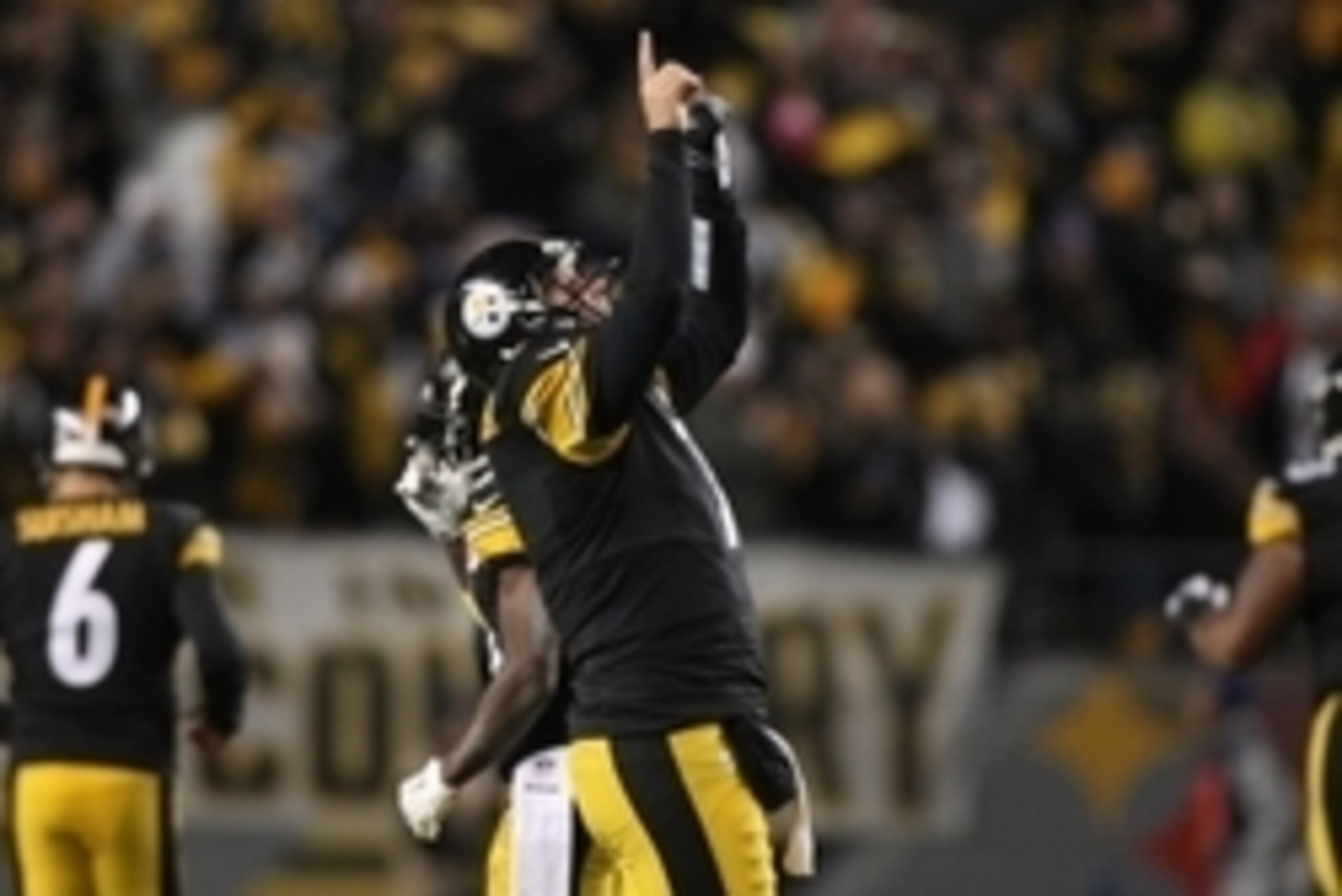 Nov 2, 2014; Pittsburgh, PA, USA; Pittsburgh Steelers quarterback Ben Roethlisberger (7) celebrates a touchdown against the Baltimore Ravens during the first half of the game at Heinz Field. The Steelers won the game, 43-23. Mandatory Credit: Jason Bridge