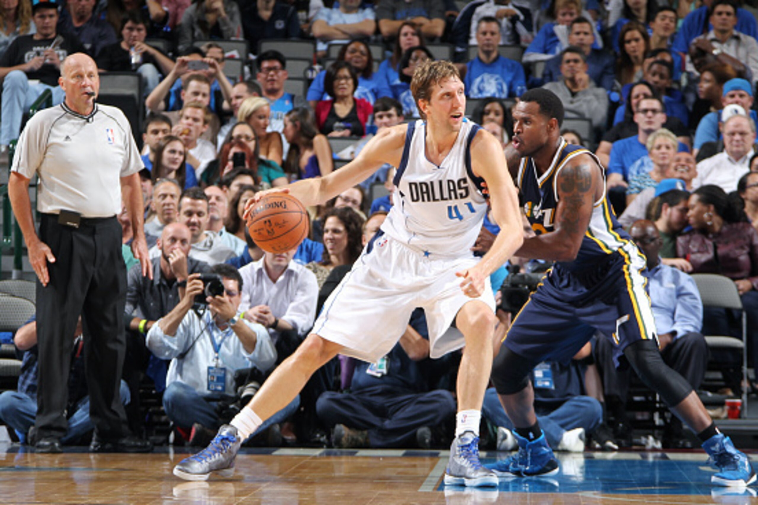 DALLAS, TX - OCTOBER 30: Dirk Nowitzki #41 of the Dallas Mavericks posts up against Trevor Booker #33 of the Utah Jazz on October 30, 2014 at the American Airlines Center in Dallas, Texas. NOTE TO USER: User expressly acknowledges and agrees that, by down