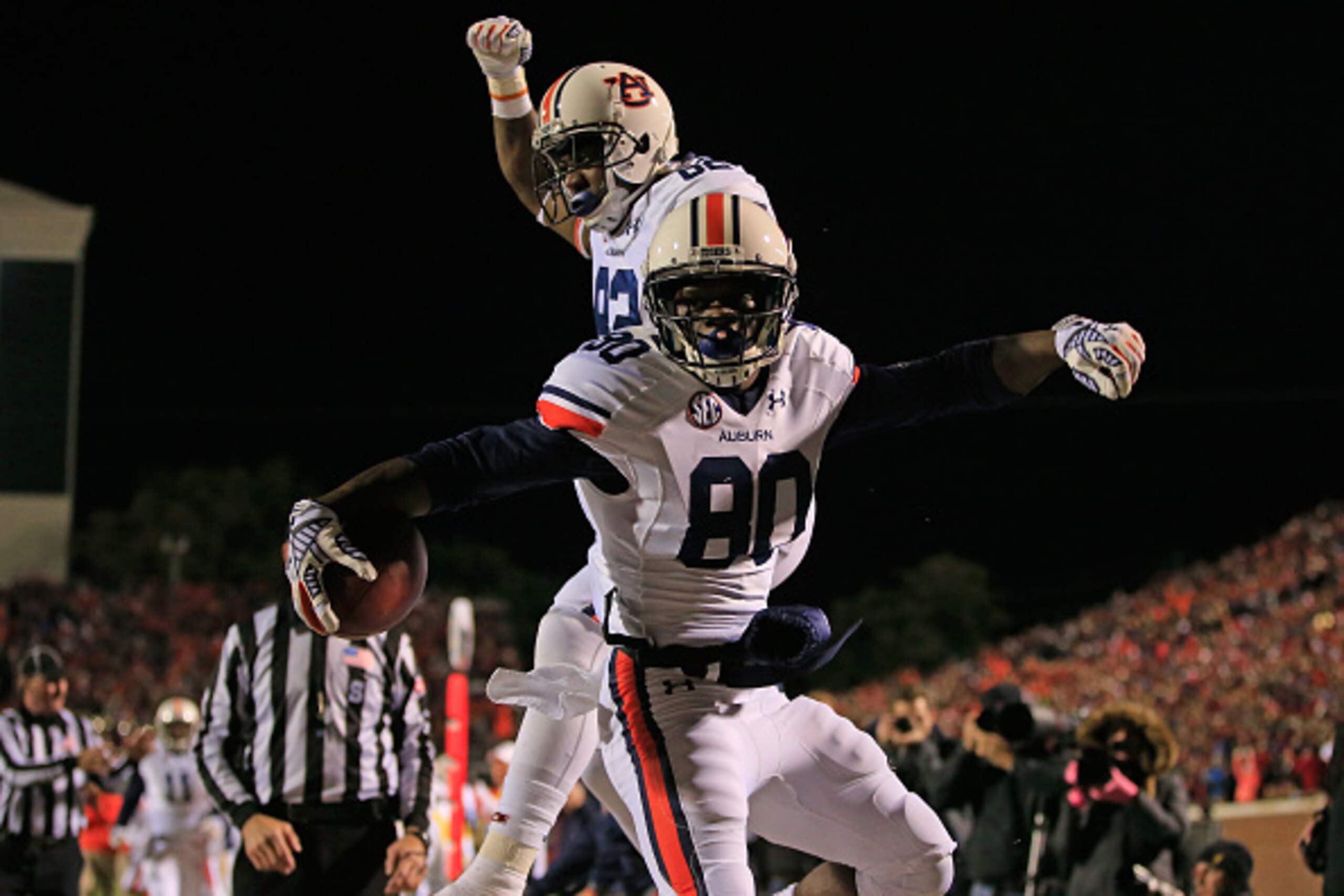 OXFORD, MS - NOVEMBER 01:  Wide receiver Marcus Davis #80 of the Auburn Tigers celebrates his 17 yard touchdown reception with Melvin Ray #82 of the Auburn Tigers to take a 28-24 lead over the Mississippi Rebels in the third quarter at Vaught-Hemingway St