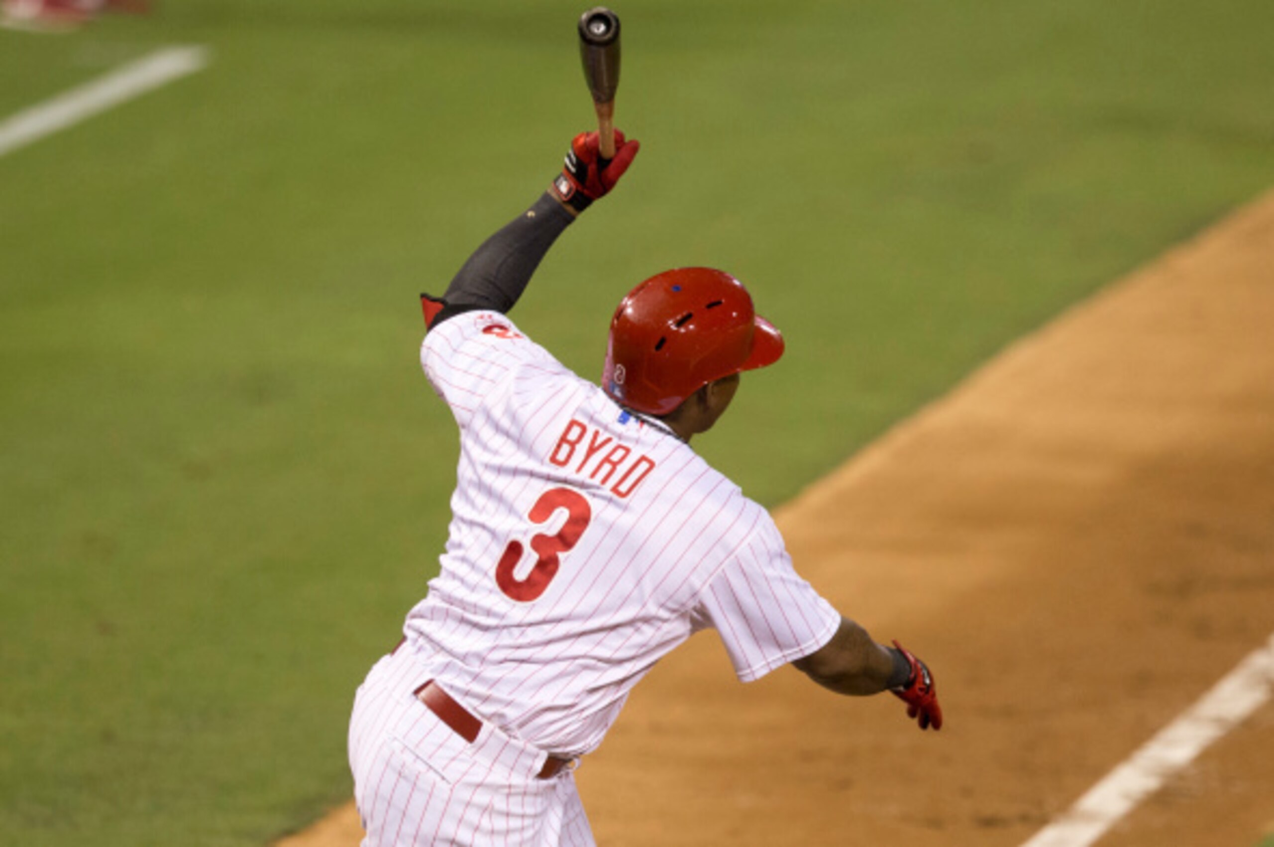 PHILADELPHIA, PA - AUGUST 22: Right fielder Marlon Byrd #3 of the Philadelphia Phillies hits a sacrifice fly in the bottom of the third inning against the St. Louis Cardinals on August 22, 2014 at Citizens Bank Park in Philadelphia, Pennsylvania. (Photo b