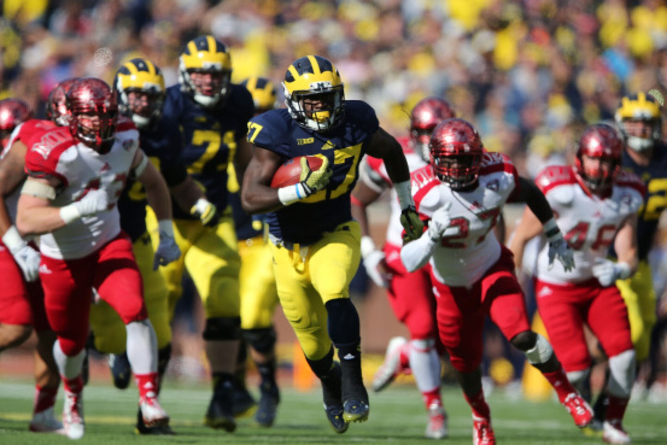 ANN ARBOR, MI - SEPTEMBER 13:  Derrick Green #27 of the University of Michigan runs for a first down during the fourth quarter of the game against the Miami University Redhawks at Michigan Stadium on September 13, 2014 in Ann Arbor, Michigan. the Wolverin