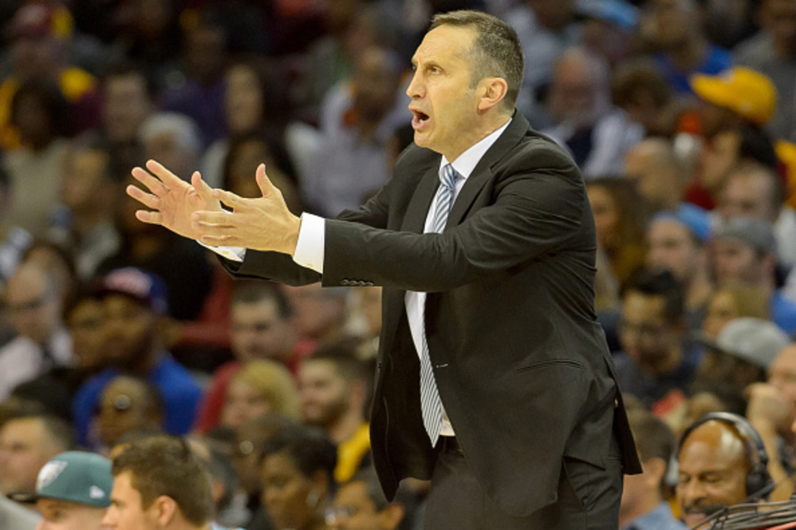 CLEVELAND, OH - OCTOBER 14: Head coach David Blatt of the Cleveland Cavaliers yells to his players during the first half  against the Dallas Mavericks at Quicken Loans Arena on October 14, 2014 in Cleveland, Ohio. User expressly acknowledges and agrees th