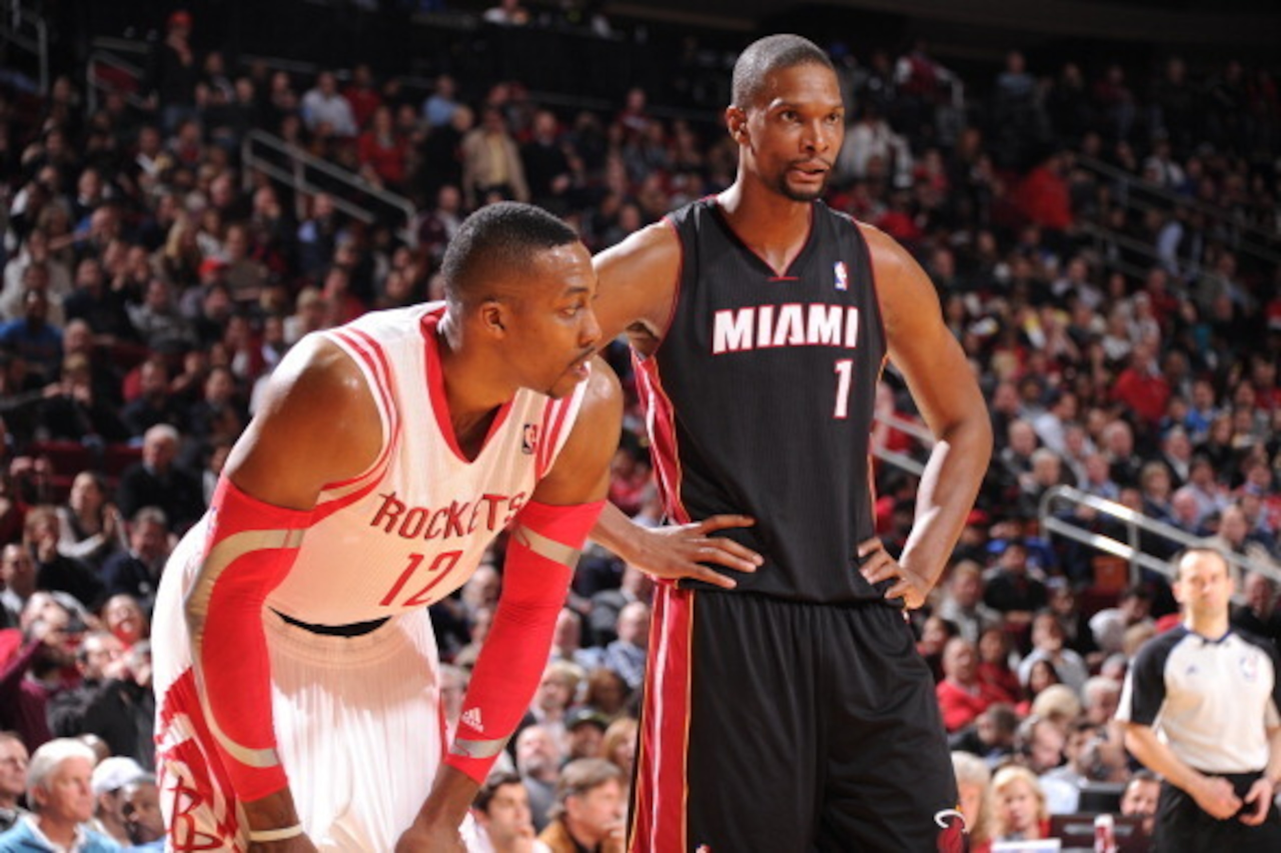 HOUSTON, TX - MARCH 4:  Chris Bosh #1 of the Miami Heat and Dwight Howard #12 of the Houston Rockets during the game on March 4, 2014 at the Toyota Center in Houston, Texas. NOTE TO USER: User expressly acknowledges and agrees that, by downloading and or 