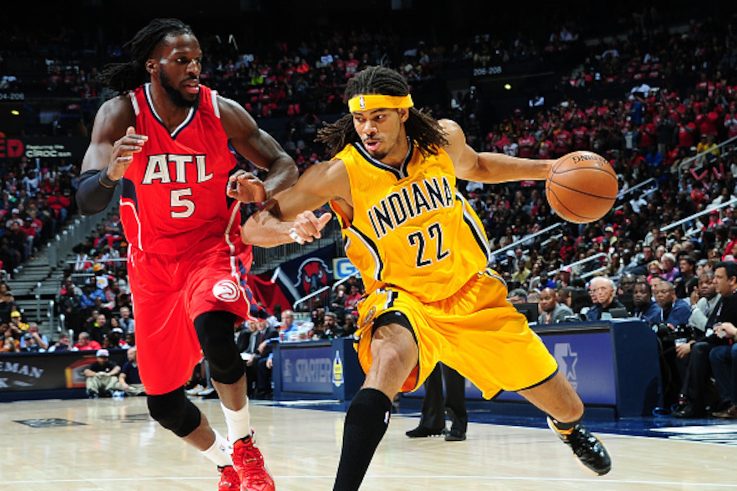 ATLANTA, GA - NOVEMBER 1: Chris Copeland #22 of the Indiana Pacers defends the ball against DeMarre Carroll #5 of the Atlanta Hawks during the game on November 1, 2014 at Philips Arena in Atlanta, Georgia. NOTE TO USER: User expressly acknowledges and agr