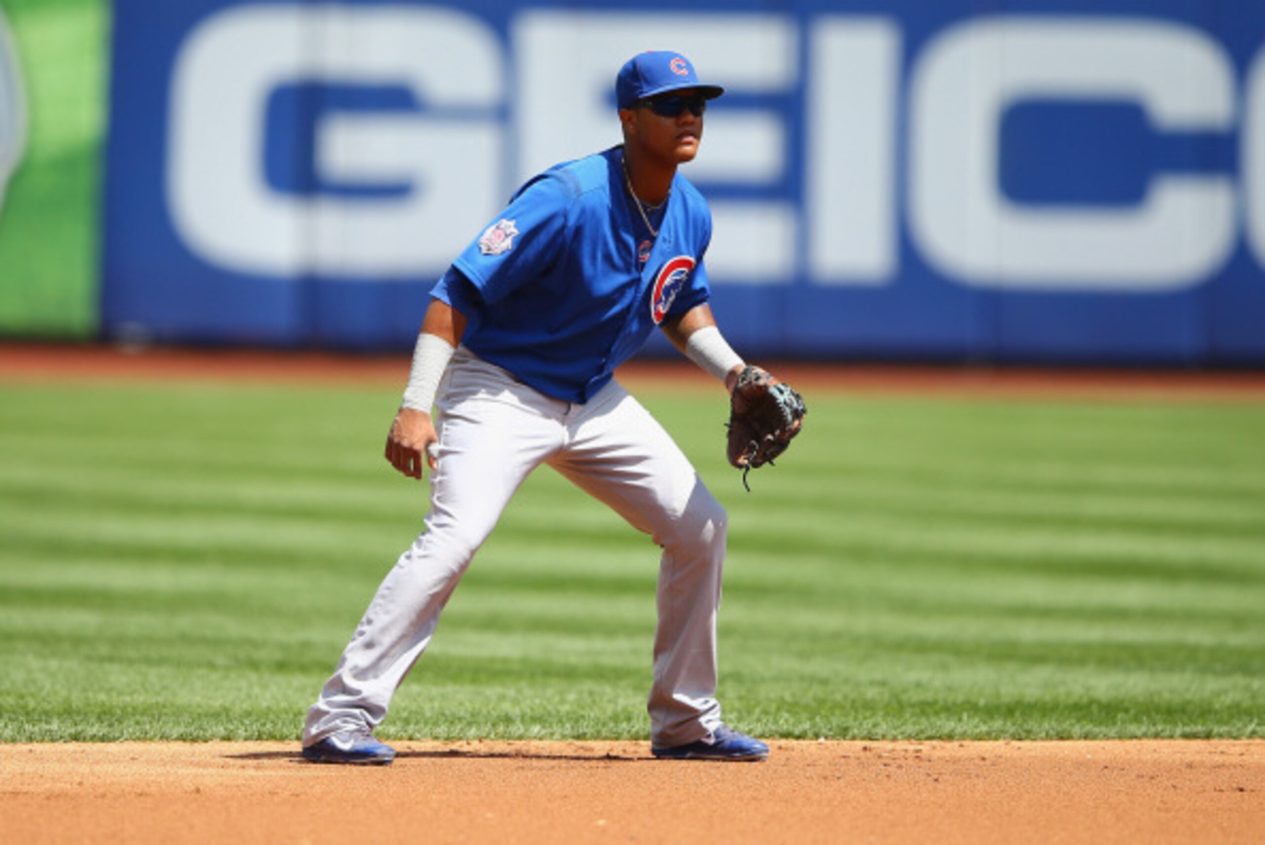 NEW YORK, NY - AUGUST 18:  Starlin Castro #13 of the Chicago Cubs in action against the New York Mets during their game on August 18, 2014 at Citi Field in the Flushing neighborhood of the Queens borough of New York City.  (Photo by Al Bello/Getty Images)