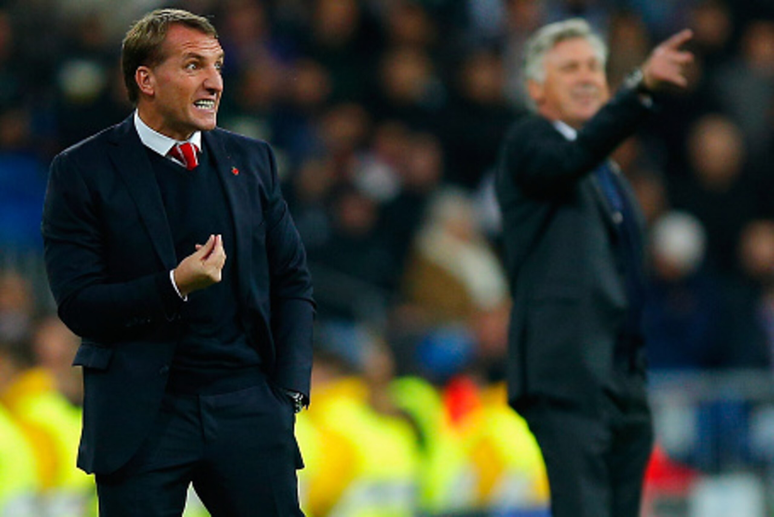 MADRID, SPAIN - NOVEMBER 04: Brendan Rodgers, manager of Liverpool and Head Coach Carlo Ancelotti of Real Madrid CF give instructions from the touchline during the UEFA Champions League Group B match between Real Madrid CF and Liverpool FC at Estadio Sant MADRID, SPAIN - NOVEMBER 04: Brendan Rodgers, manager of Liverpool and Head Coach Carlo Ancelotti of Real Madrid CF give instructions from the touchline during the UEFA Champions League Group B match between Real Madrid CF and Liverpool FC at Estadio Sant