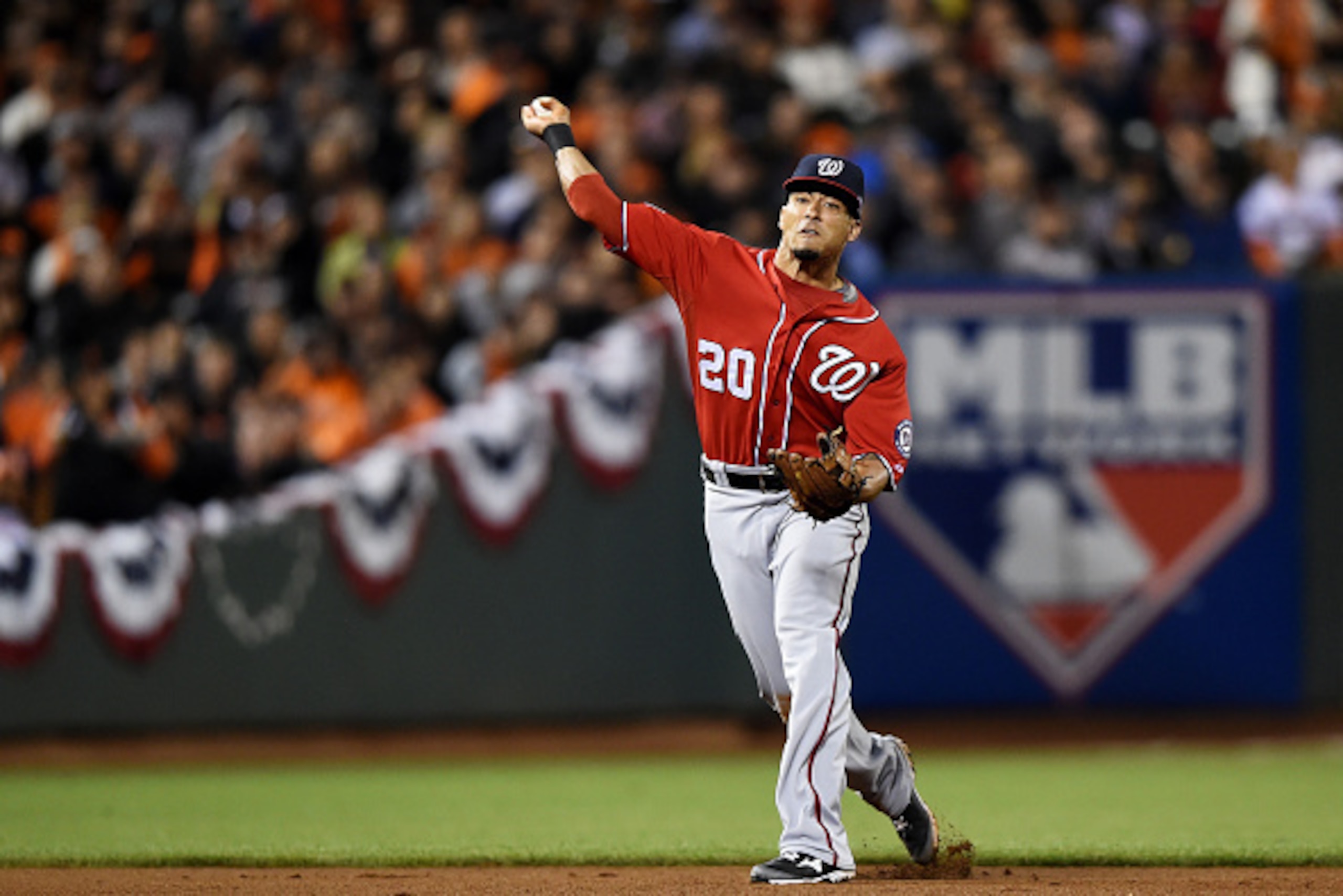 SAN FRANCISCO, CA - OCTOBER 07:  Ian Desmond #20 of the Washington Nationals fields a ball for an out on Matt Duffy #50 of the San Francisco Giants in the sixth inning during Game Four of the National League Division Series at AT&T Park on October 7, 2014