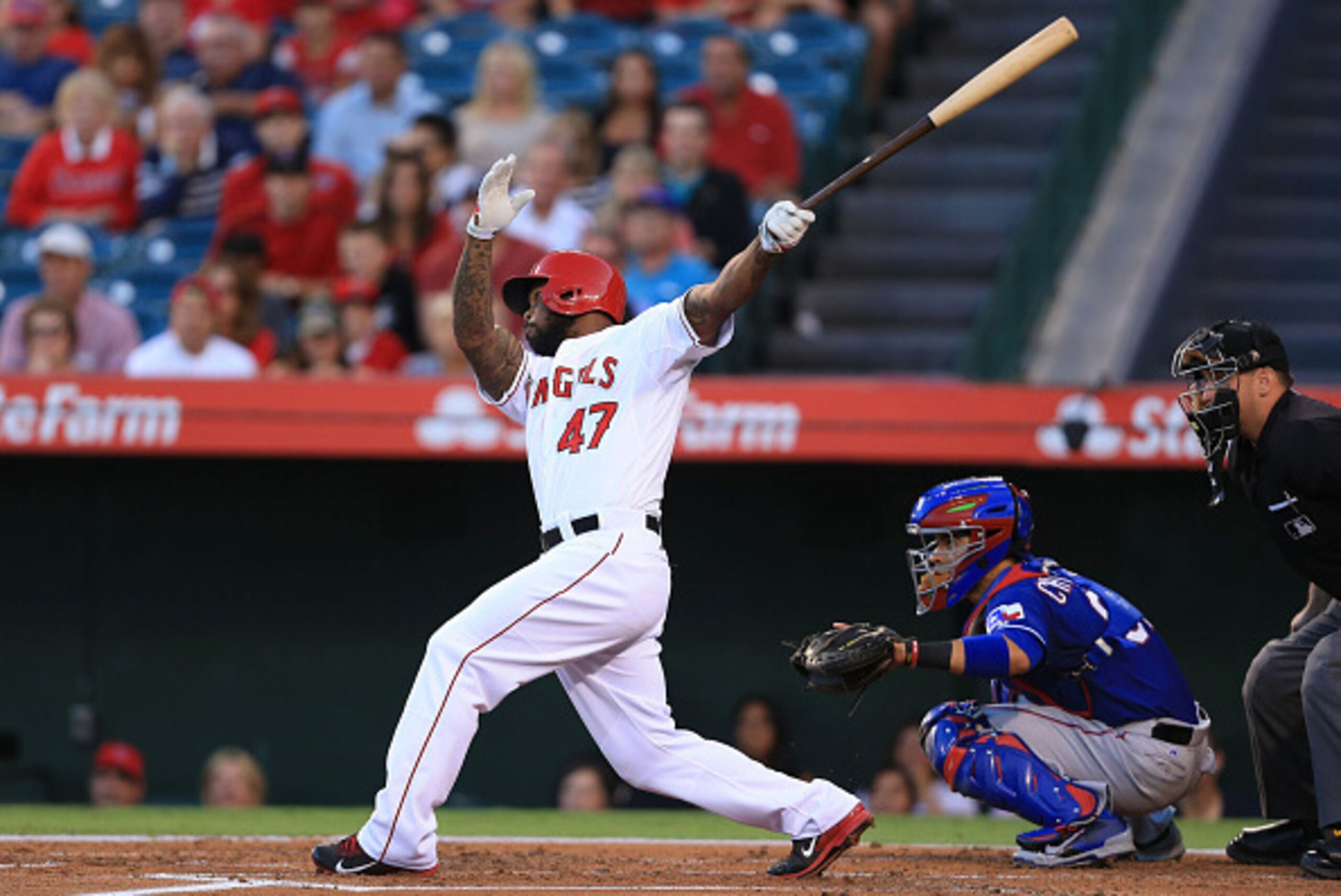 ANAHEIM, CA - SEPTEMBER 20:  Howie Kendrick #47 of the Los Angeles Angels of Anaheim hits a double to deep right field in the first inning to drive in Mike Trout #27 (not in photo) from first base during the MLB game against the Texas Rangers at Angel Sta