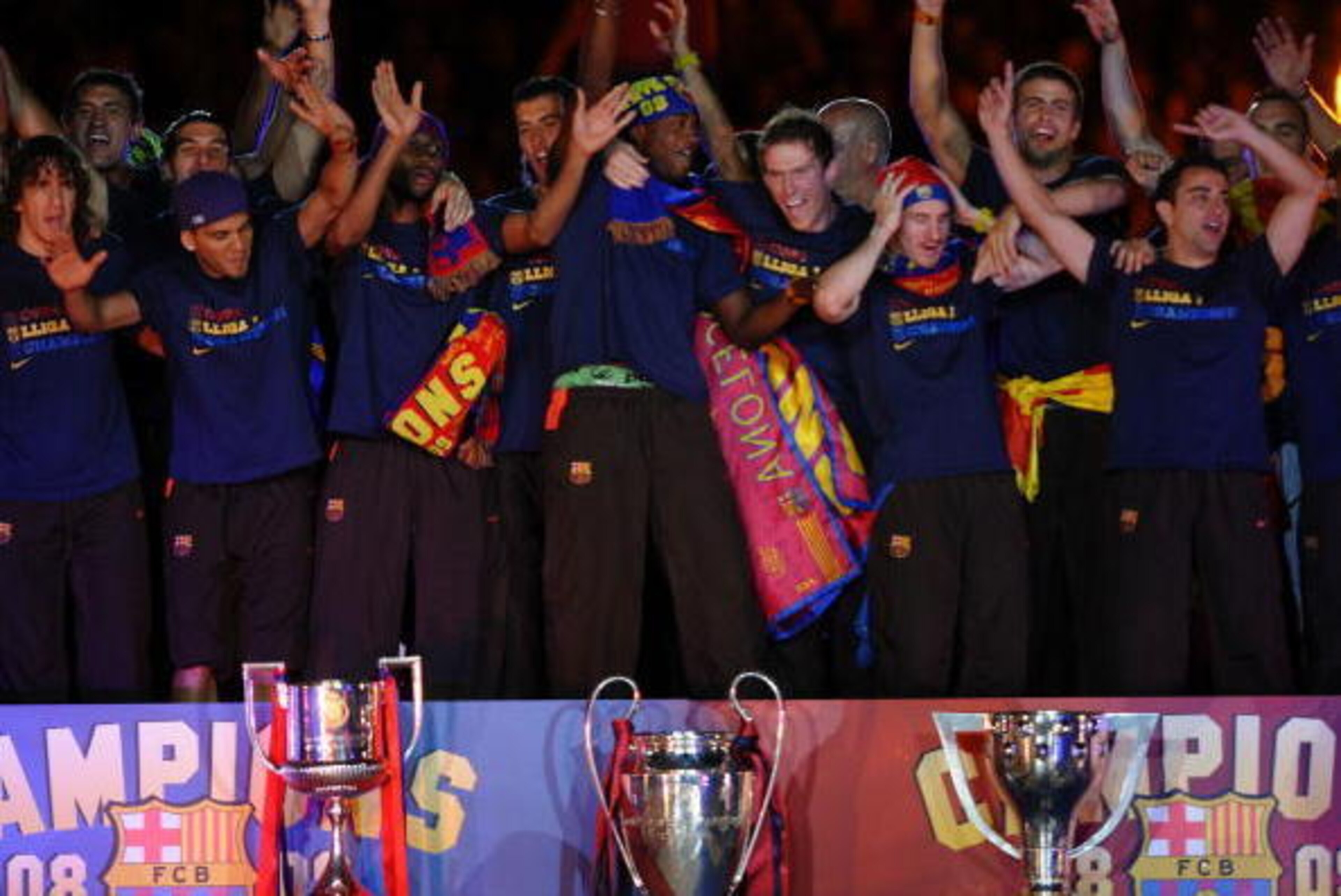BARCELONA, SPAIN - MAY 28: Barcelona players celebrate beside their three thophys, Copa del Rey (L), UEFA Champions League and La Liga at the Nou Camp Stadium the day after Barcelona won the UEFA Champions League Cup final on May 28, 2009 in Barcelona, Sp