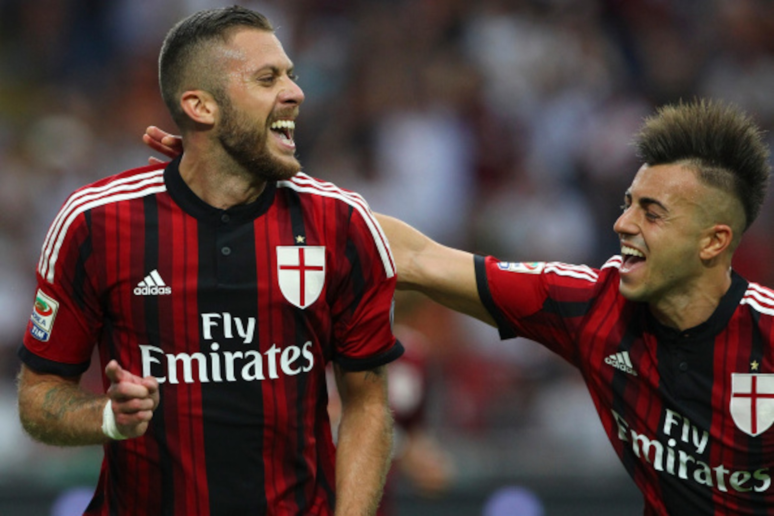 MILAN, ITALY - AUGUST 31:  Jeremy Menez of AC Milan celebrates with his team-mate Stephan El Shaarawy after scoring his goal during the Serie A match between AC Milan and SS Lazio at Stadio Giuseppe Meazza on August 31, 2014 in Milan, Italy.  (Photo by Ma
