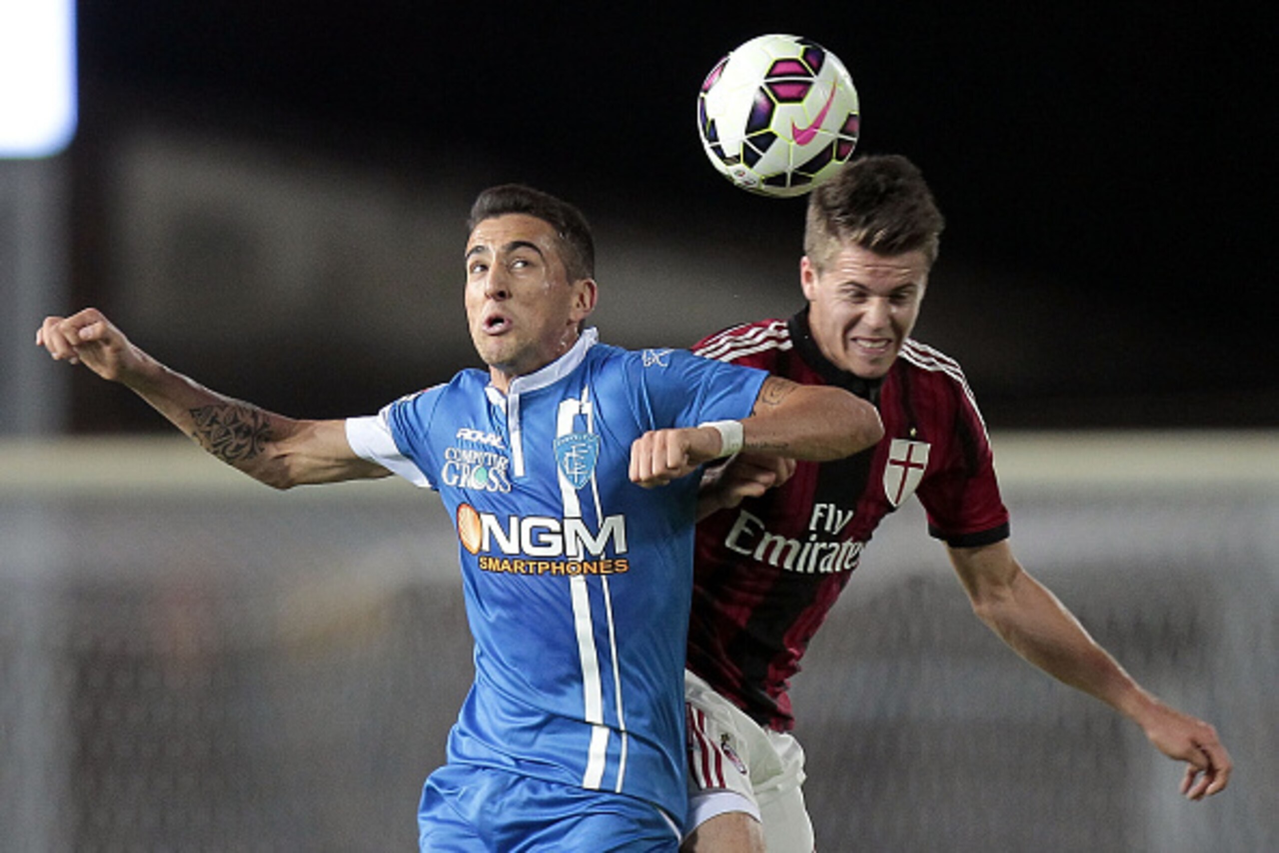 EMPOLI, ITALY - SEPTEMBER 23: Matias Vecino of Empoli Fc battles for the ball with Marco Van Ginkel of AC Milan during the Serie A match between Empoli FC and AC Milan at Stadio Carlo Castellani on September 23, 2014 in Empoli, Italy.  (Photo by Gabriele 
