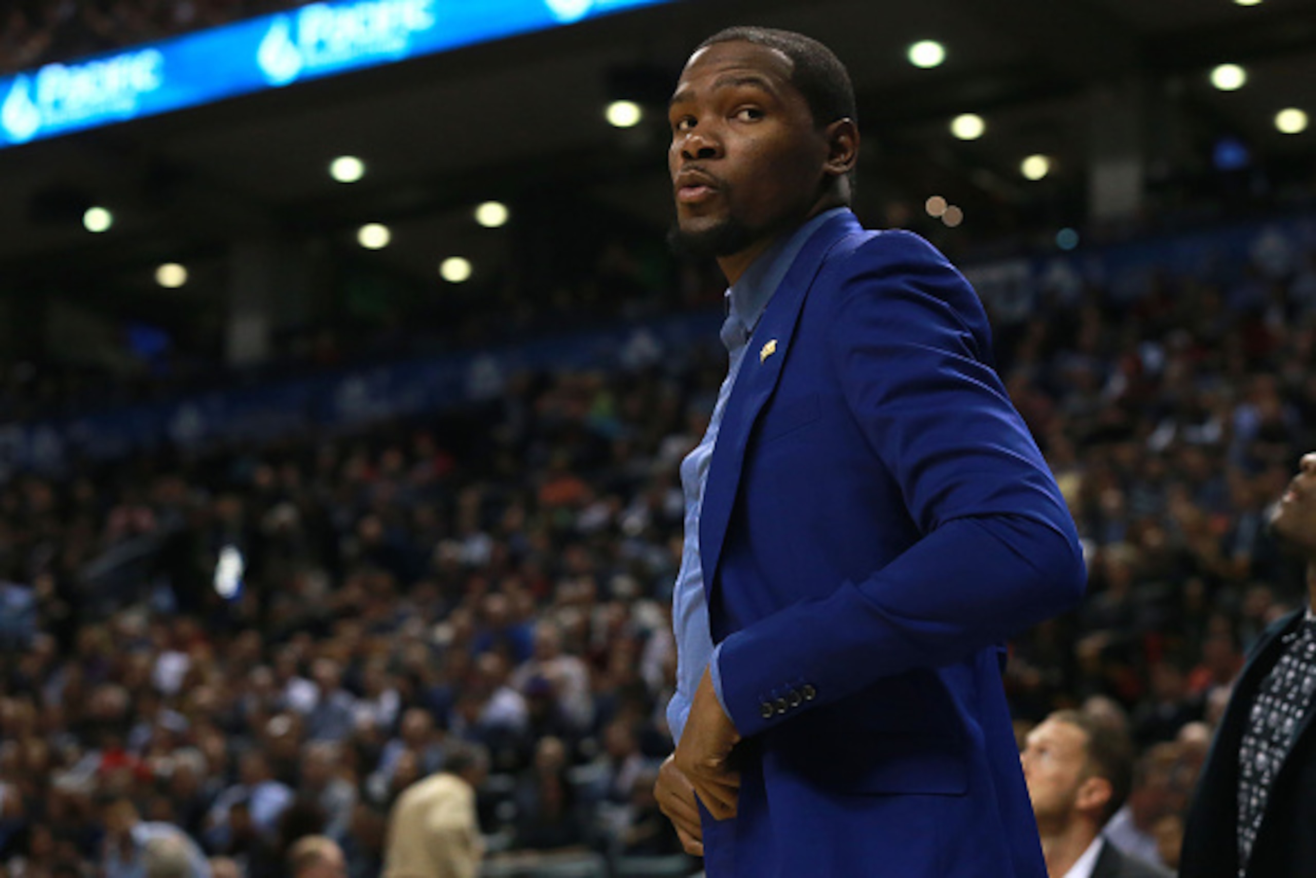 TORONTO, ON - NOVEMBER 4:  Kevin Durant #35 of the Oklahoma City Thunder looks on from the bench as his team faces the Toronto Raptors during their game at Air Canada Centre on November 4, 2014 in Toronto, Canada. NOTE TO USER: User expressly acknowledges