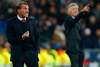 MADRID, SPAIN - NOVEMBER 04: Brendan Rodgers, manager of Liverpool and Head Coach Carlo Ancelotti of Real Madrid CF give instructions from the touchline during the UEFA Champions League Group B match between Real Madrid CF and Liverpool FC at Estadio Sant