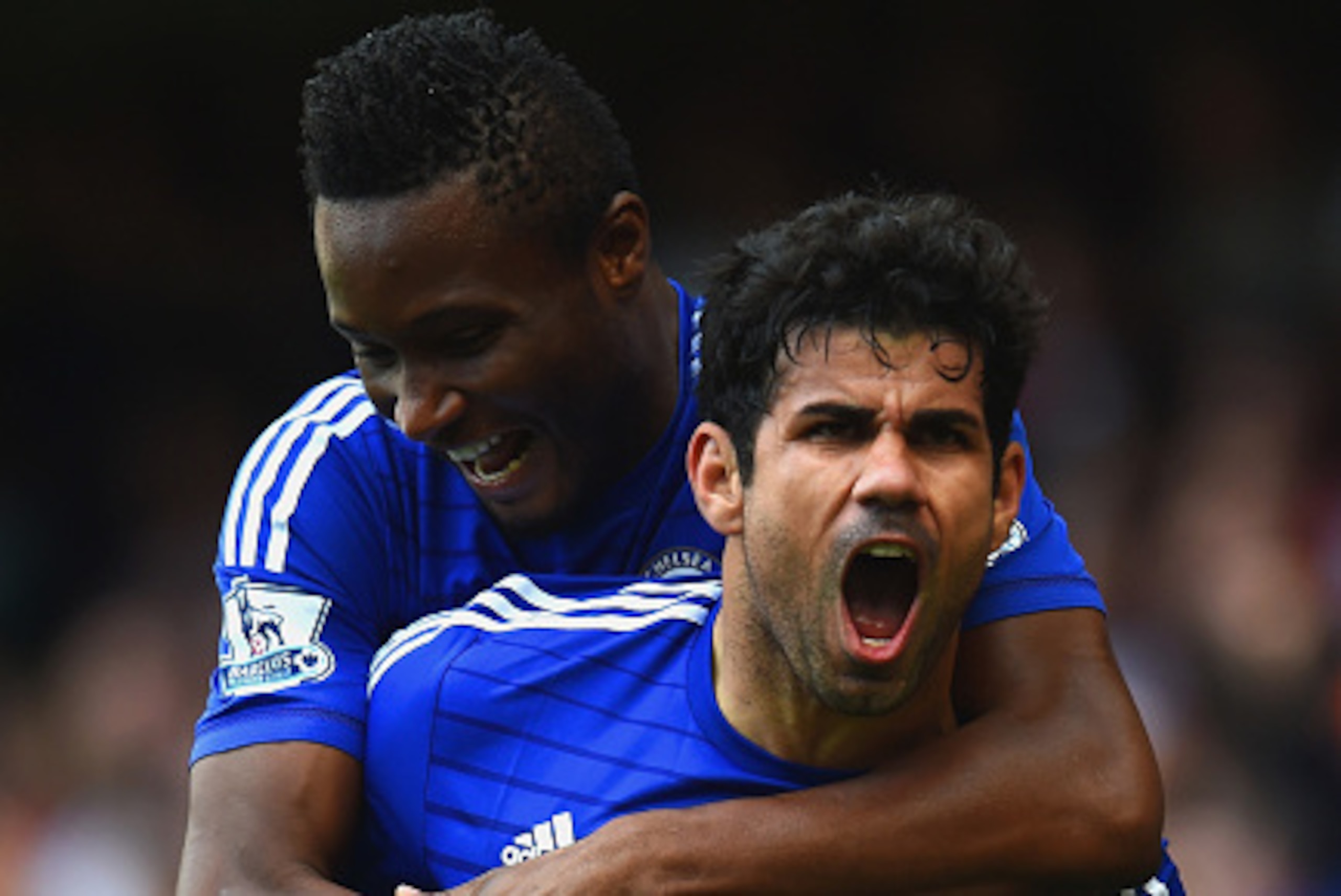LONDON, ENGLAND - OCTOBER 05:  (EDITORS NOTE: Retransmission with alternate crop) Diego Costa of Chelsea celebrates scoring their second goal with John Obi Mikel of Chelsea during the Barclays Premier League match between Chelsea and Arsenal at Stamford B