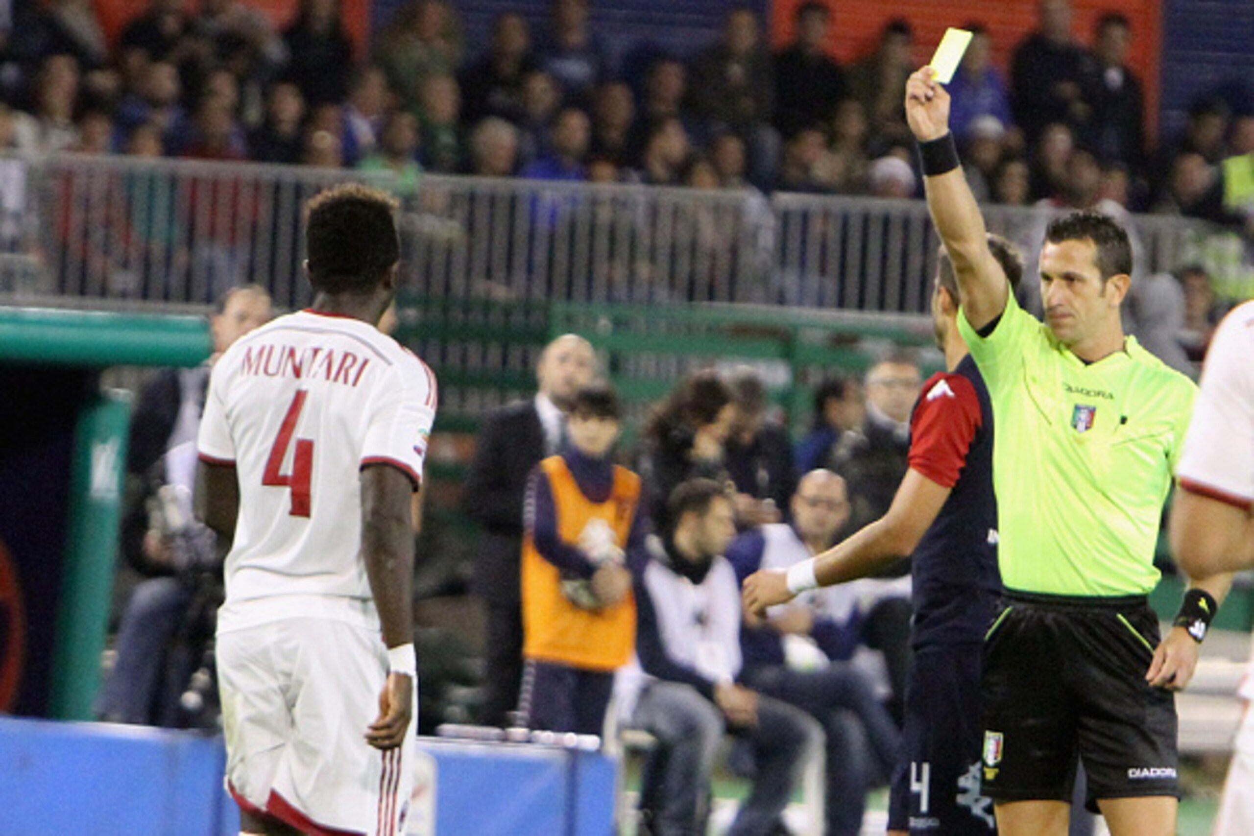CAGLIARI, ITALY - OCTOBER 29: Muntari of Milan receives the yellow card during the Serie A match between Cagliari Calcio and AC Milan at Stadio Sant'Elia on October 29, 2014 in Cagliari, Italy.  (Photo by Enrico Locci/Getty Images)