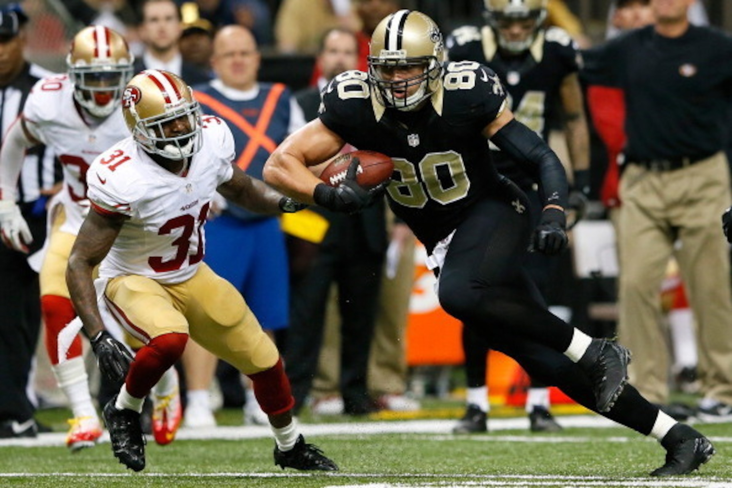 NEW ORLEANS, LA - NOVEMBER 17:  Jimmy Graham #80 of the New Orleans Saints pulls in this reception against Donte Whitner #31 of the San Francisco 49ers at Mercedes-Benz Superdome on November 17, 2013 in New Orleans, Louisiana.  (Photo by Kevin C. Cox/Gett