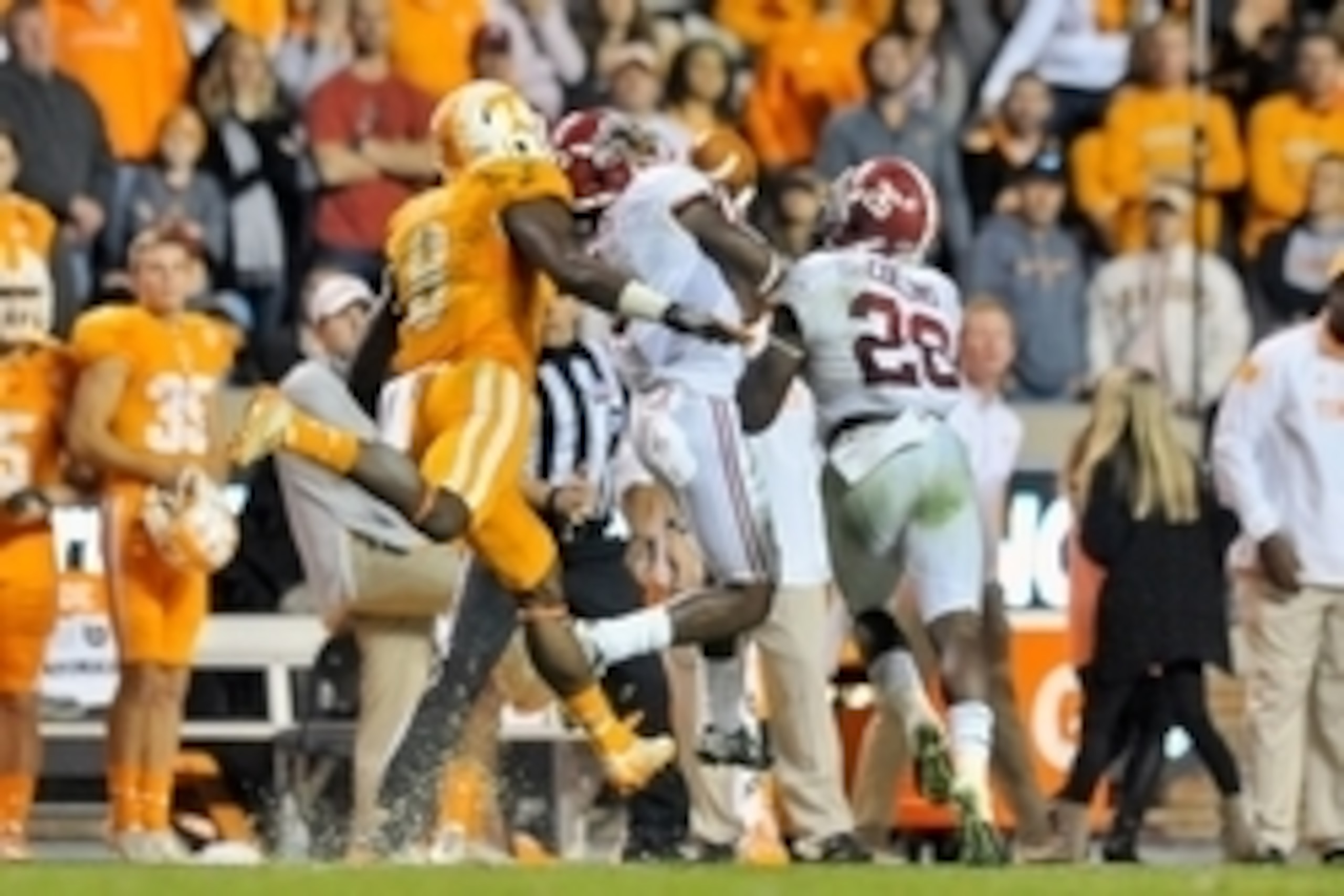 Oct 25, 2014; Knoxville, TN, USA; Alabama Crimson Tide defensive back Cyrus Jones (5) intercepts the pass intended for Tennessee Volunteers wide receiver Marquez North (8) during the second half game at Neyland Stadium. Alabama won 34-20. Mandatory Credit