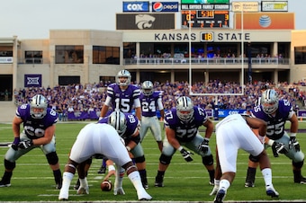 MANHATTAN, KS - SEPTEMBER 18:  Quarterback Jake Waters #15 of the Kansas State Wildcats prepares to snap the ball during the game against the Auburn Tigers at Bill Snyder Family Football Stadium on September 18, 2014 in Manhattan, Kansas.  (Photo by Jamie