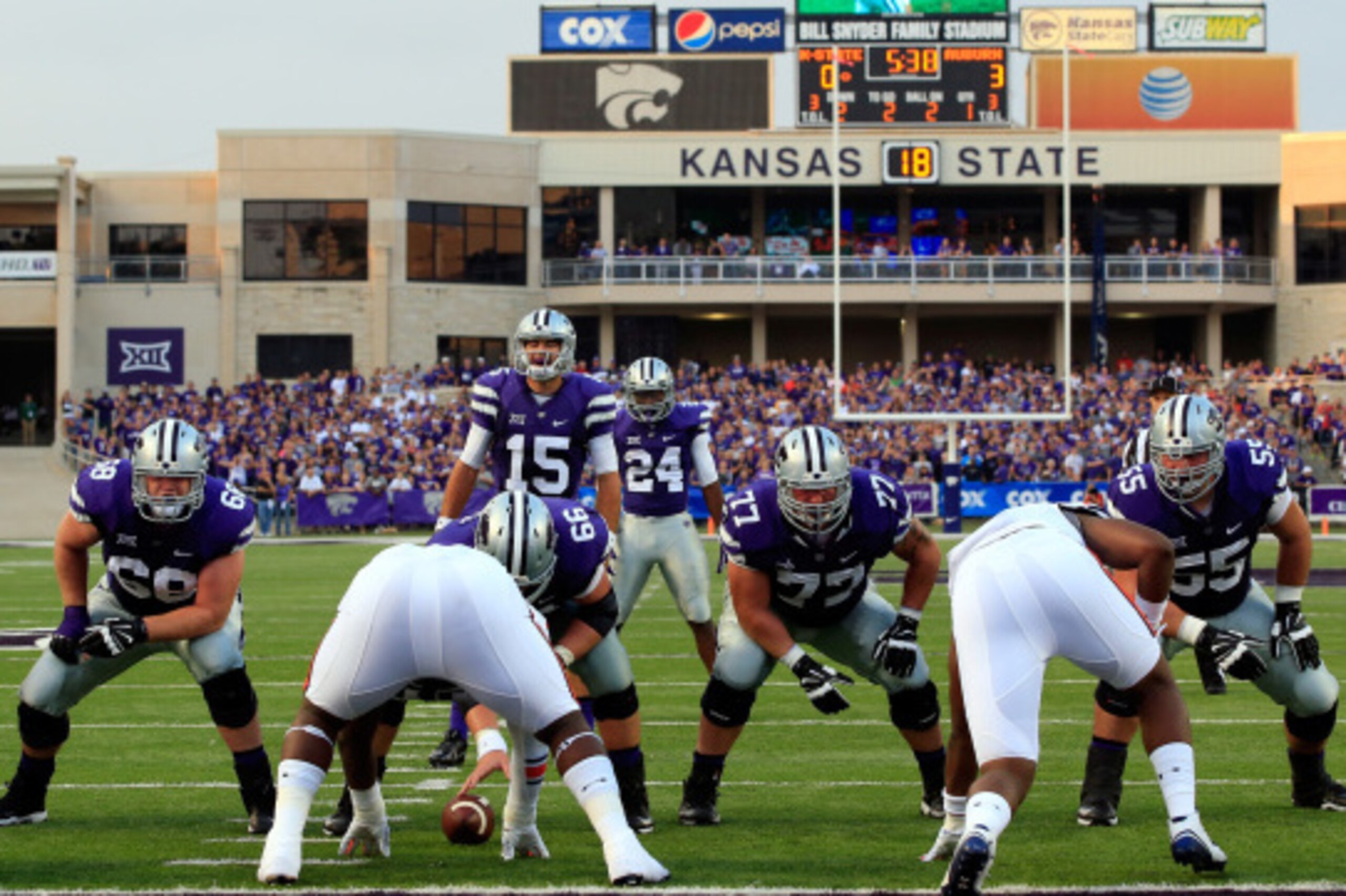 MANHATTAN, KS - SEPTEMBER 18:  Quarterback Jake Waters #15 of the Kansas State Wildcats prepares to snap the ball during the game against the Auburn Tigers at Bill Snyder Family Football Stadium on September 18, 2014 in Manhattan, Kansas.  (Photo by Jamie