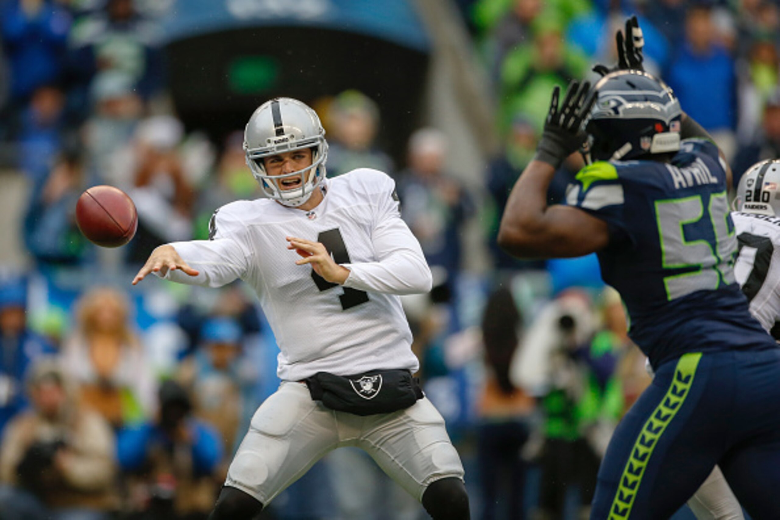 SEATTLE, WA - NOVEMBER 02:  Quarterback Derek Carr #4 of the Oakland Raiders passes against the Seattle Seahawks at CenturyLink Field on November 2, 2014 in Seattle, Washington.  (Photo by Otto Greule Jr/Getty Images)