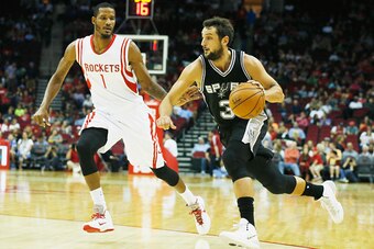 HOUSTON, TX - OCTOBER 24:  Marco Belinelli #3 of the San Antonio Spurs drives with the ball against Trevor Ariza #1 of the Houston Rockets during their preseason game at Toyota Center on October 24, 2014 in Houston, Texas NOTE TO USER: User expressly ackn