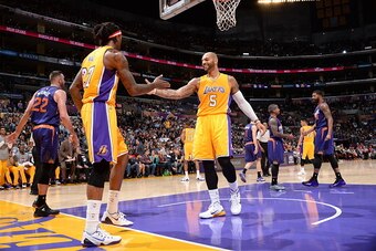 LOS ANGELES, CA - NOVEMBER 04: Carlos Boozer #5 and Jordan Hill #27 of the Los Angeles Lakers celebrate during a game against the Phoenix Suns at STAPLES Center on November 04, 2014 in Los Angeles, California. NOTE TO USER: User expressly acknowledges and