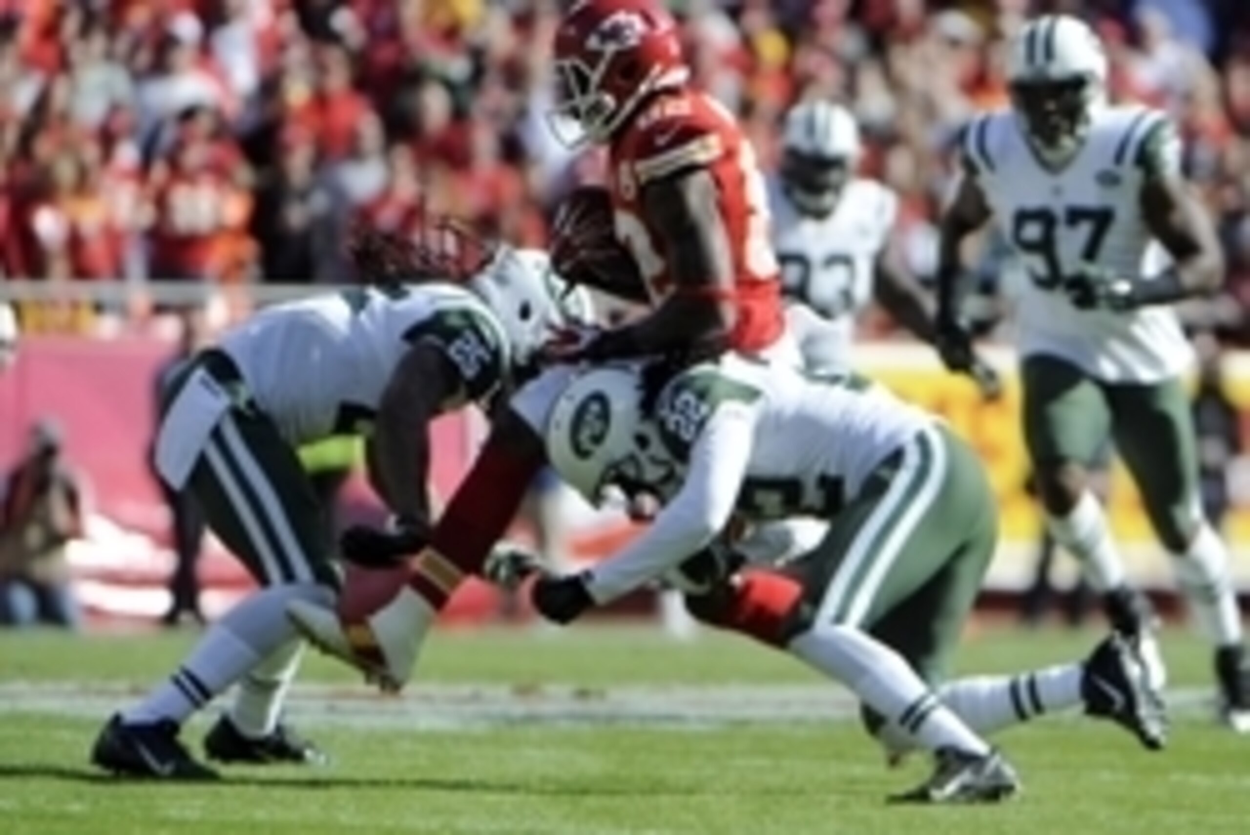 Nov 2, 2014; Kansas City, MO, USA; Kansas City Chiefs wide receiver Dwayne Bowe (82) is tackled by New York Jets cornerback Marcus Williams (22) and free safety Calvin Pryor (25) in the first half at Arrowhead Stadium. Mandatory Credit: John Rieger-USA TO