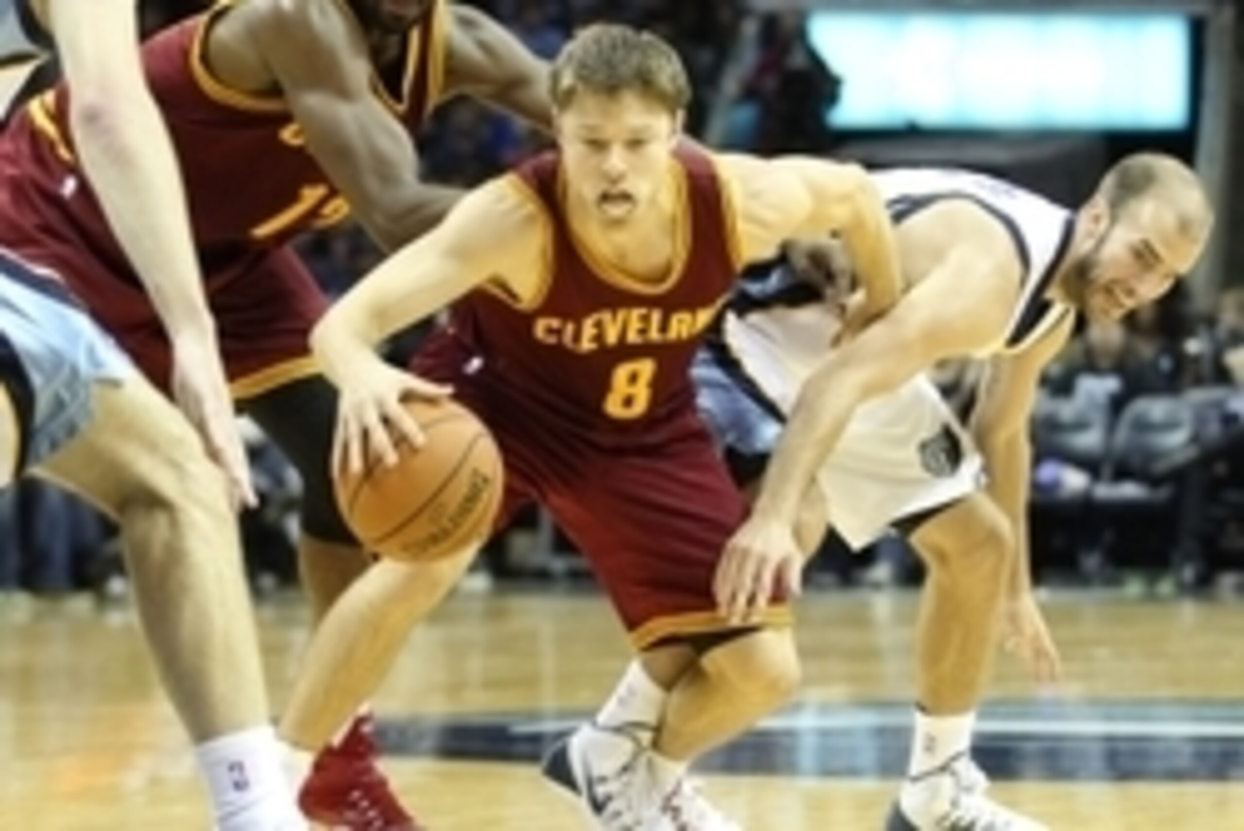 Oct 22, 2014; Memphis, TN, USA; Cleveland Cavaliers guard Matthew Dellavedova (8) drives between forward Tristan Thompson (13) and Memphis Grizzlies guard Nick Calathes (12) at FedExForum. Memphis defeated Cleveland 96-92. Mandatory Credit: Nelson Chenaul