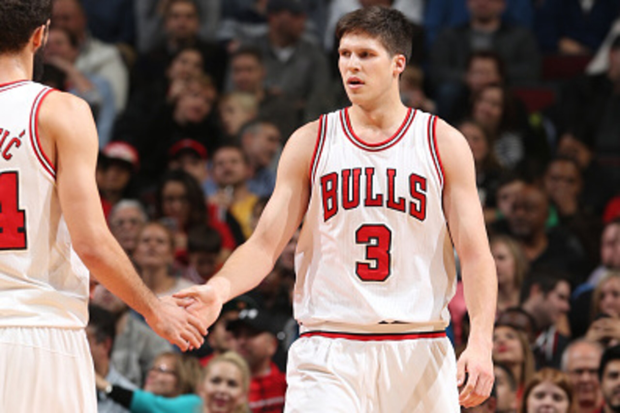 CHICAGO, IL - NOVEMBER 4: Doug McDermott #3 of the Chicago Bulls celebrates during a game against the Orlando Magic on November 4, 2014 at the United Center in Chicago, Illinois. NOTE TO USER: User expressly acknowledges and agrees that, by downloading an