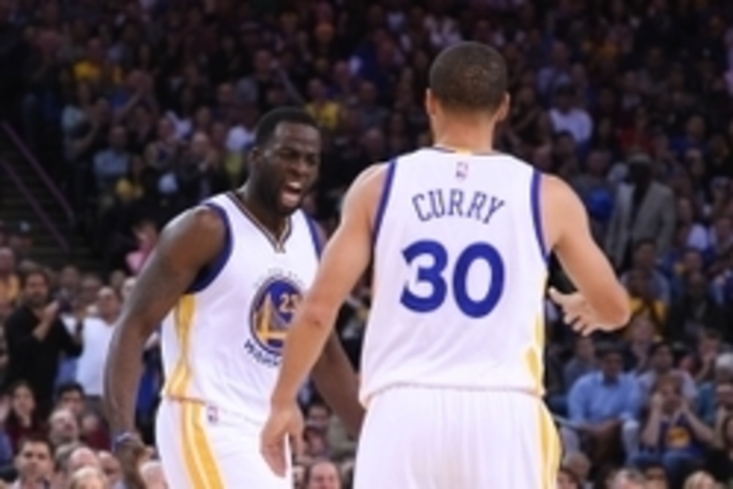 November 5, 2014; Oakland, CA, USA; Golden State Warriors forward Draymond Green (23) celebrates with guard Stephen Curry (30) against the Los Angeles Clippers during the second quarter at Oracle Arena. Mandatory Credit: Kyle Terada-USA TODAY Sports