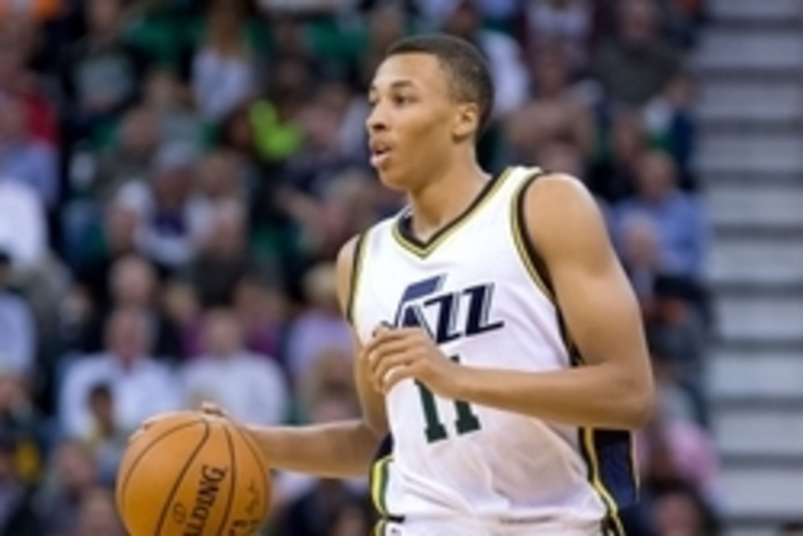 Nov 5, 2014; Salt Lake City, UT, USA; Utah Jazz guard Dante Exum (11) dribbles up the court during the first half against the Cleveland Cavaliers at EnergySolutions Arena. Mandatory Credit: Russ Isabella-USA TODAY Sports
