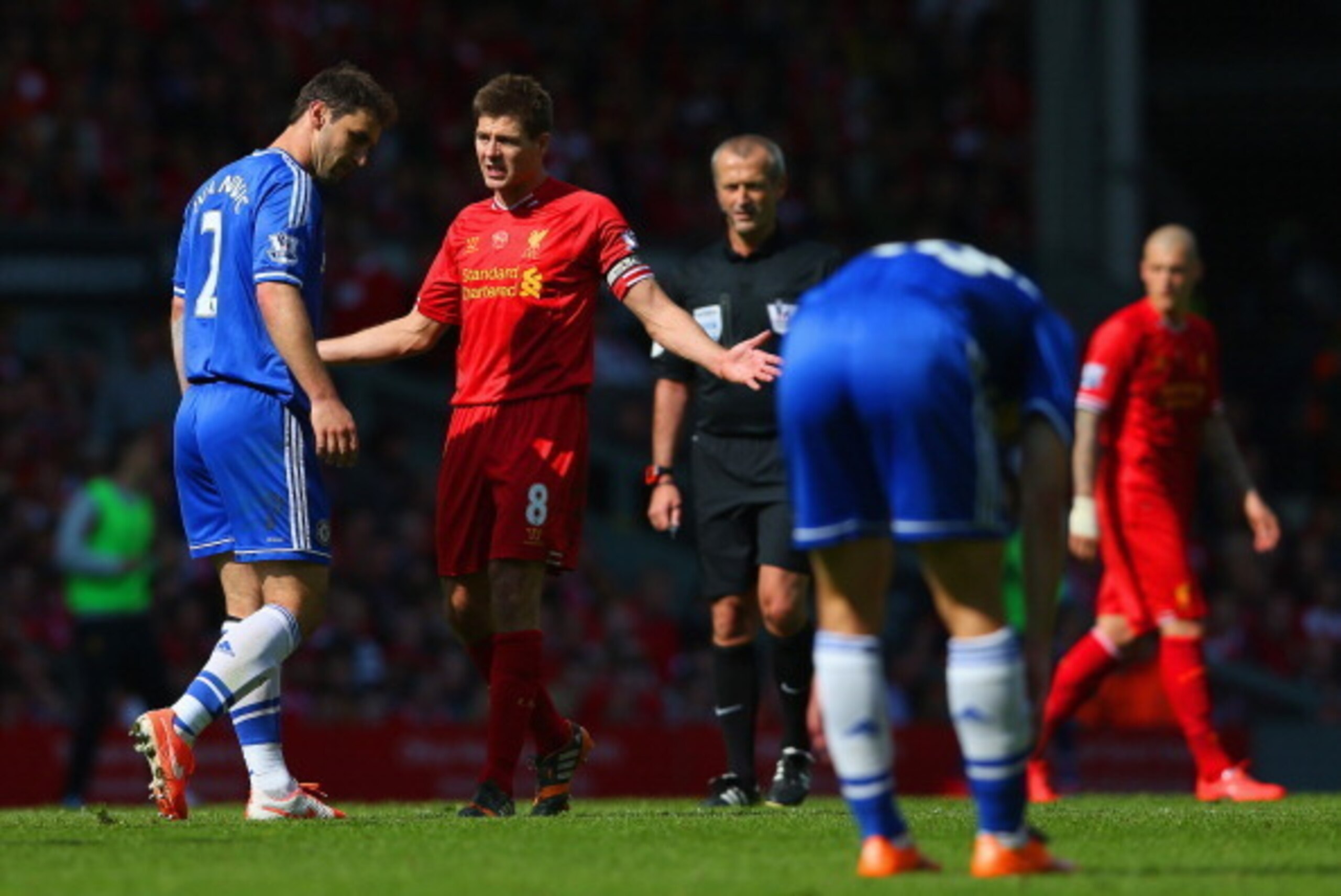 LIVERPOOL, ENGLAND - APRIL 27: Steven Gerrard of Liverpool appeals as Branislav Ivanovic of Chelsea looks to the ground during the Barclays Premier League match between Liverpool and Chelsea at Anfield on April 27, 2014 in Liverpool, England. (Photo by C LIVERPOOL, ENGLAND - APRIL 27: Steven Gerrard of Liverpool appeals as Branislav Ivanovic of Chelsea looks to the ground during the Barclays Premier League match between Liverpool and Chelsea at Anfield on April 27, 2014 in Liverpool, England. (Photo by C