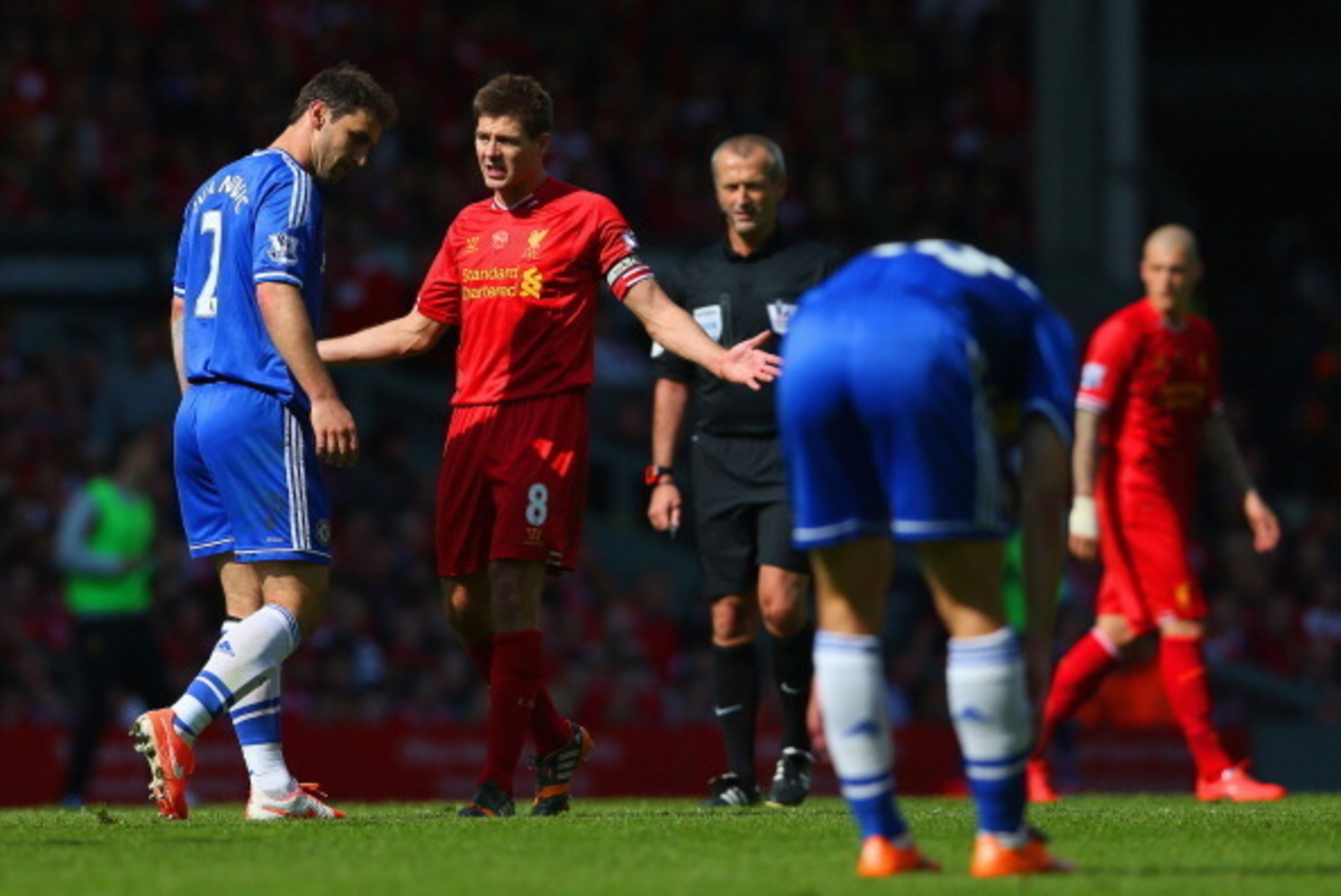LIVERPOOL, ENGLAND - APRIL 27: Steven Gerrard of Liverpool appeals as Branislav Ivanovic of Chelsea looks to the ground during the Barclays Premier League match between Liverpool and Chelsea at Anfield on April 27, 2014 in Liverpool, England.  (Photo by C