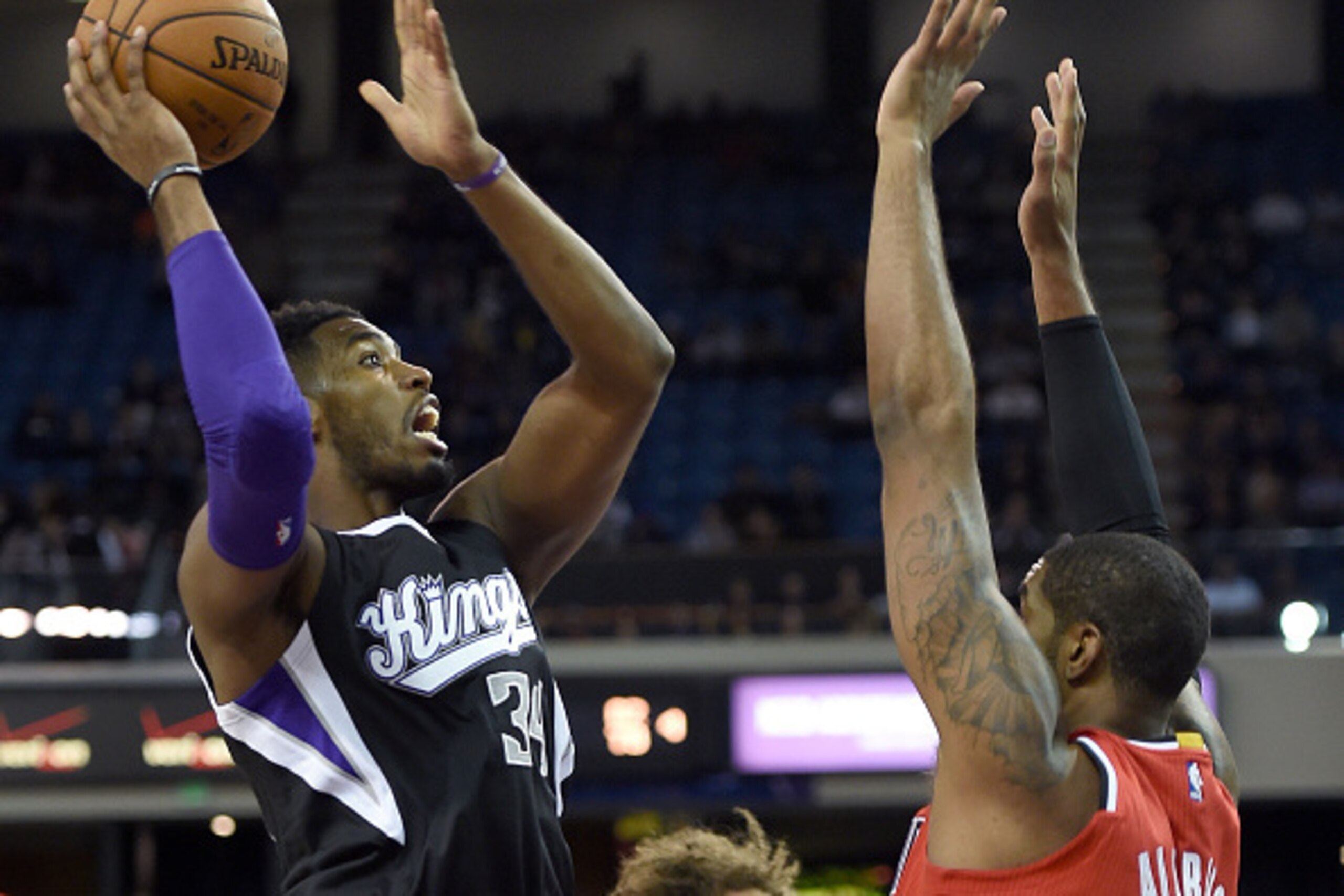 SACRAMENTO, CA - OCTOBER 31:  Jason Thompson #34 of the Sacramento Kings shoot over LeMarcus Aldridge #12 of the Portland Trail Blazers during the first half of their game at Sleep Train Arena on October 31, 2014 in Sacramento, California. NOTE TO USER: U