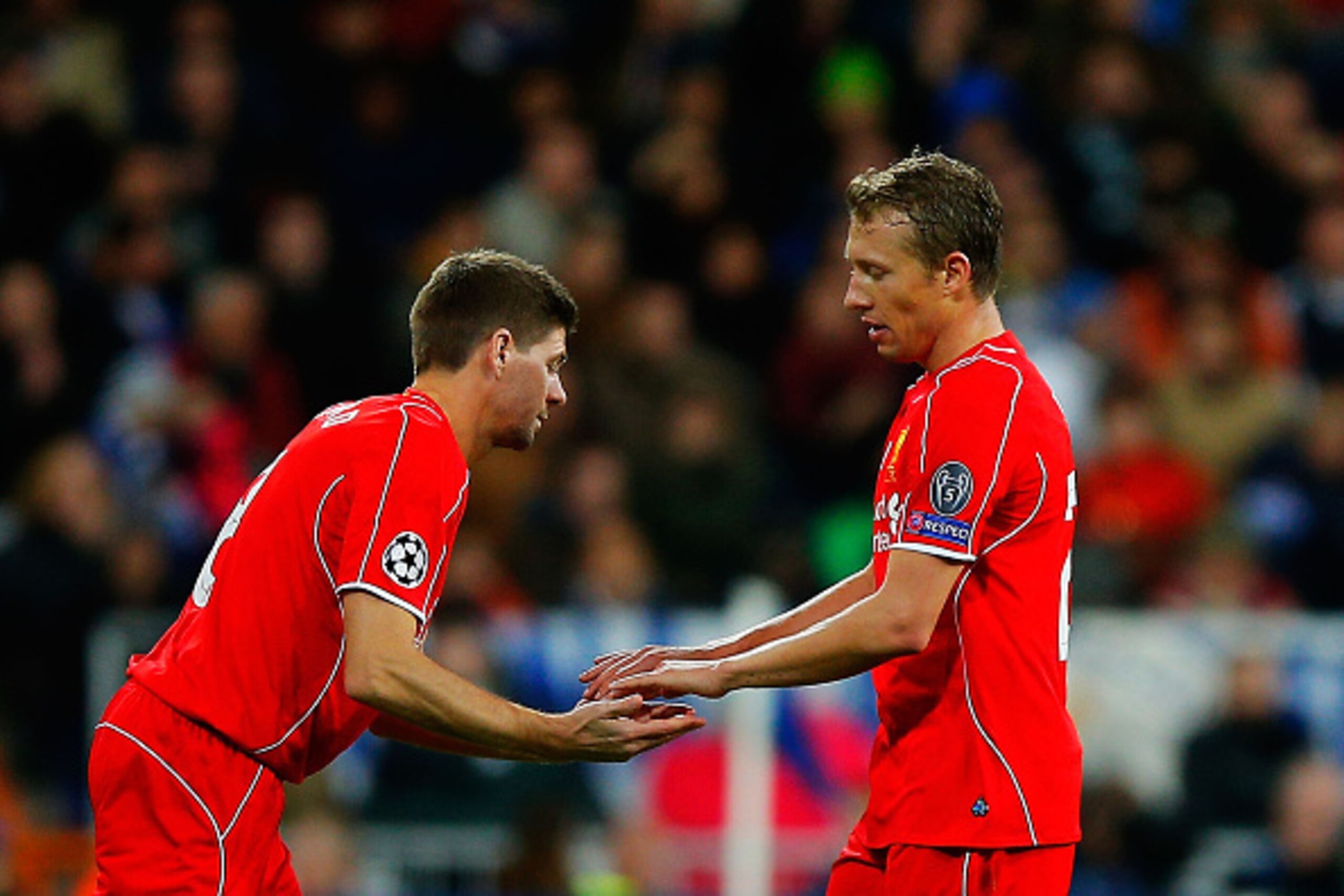 MADRID, SPAIN - NOVEMBER 04: Steven Gerrard (L) of Liverpool FC replaces team mate Lucas Leiva (R) during the UEFA Champions League Group B match between Real Madrid CF and Liverpool FC at Estadio Santiago Bernabeu on November 4, 2014 in Madrid, Spain. ( MADRID, SPAIN - NOVEMBER 04: Steven Gerrard (L) of Liverpool FC replaces team mate Lucas Leiva (R) during the UEFA Champions League Group B match between Real Madrid CF and Liverpool FC at Estadio Santiago Bernabeu on November 4, 2014 in Madrid, Spain. (