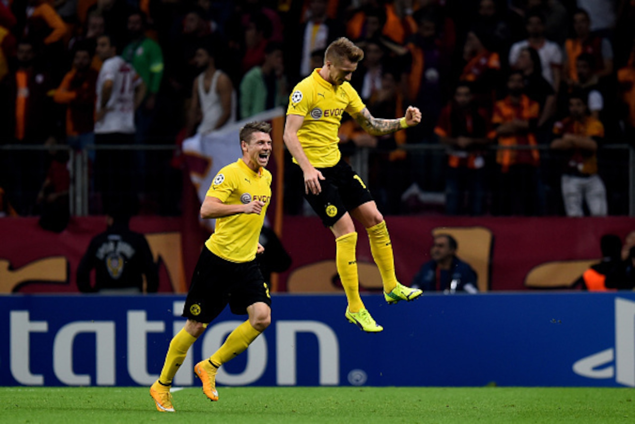 ISTANBUL, TURKEY - OCTOBER 22: Marco Reus (R) of Borussia Dortmund celerates after scoring his team's third goal during UEFA Champions League Group D match between Galatasaray and Borussia Dortmund at Turk Telekom Arena on October 22, 2014 in Istanbul, T ISTANBUL, TURKEY - OCTOBER 22: Marco Reus (R) of Borussia Dortmund celerates after scoring his team's third goal during UEFA Champions League Group D match between Galatasaray and Borussia Dortmund at Turk Telekom Arena on October 22, 2014 in Istanbul, T