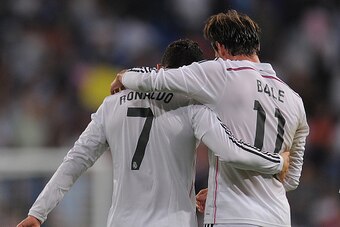 MADRID, SPAIN - OCTOBER 05:  Cristiano Ronaldo of Real Madrid celebrates with Gareth Bale after scoring his team's 5th and his third goal against Club Athletic during the La Liga match between Real Madrid CF and Athletic Club at Estadio Santiago Bernabeu 