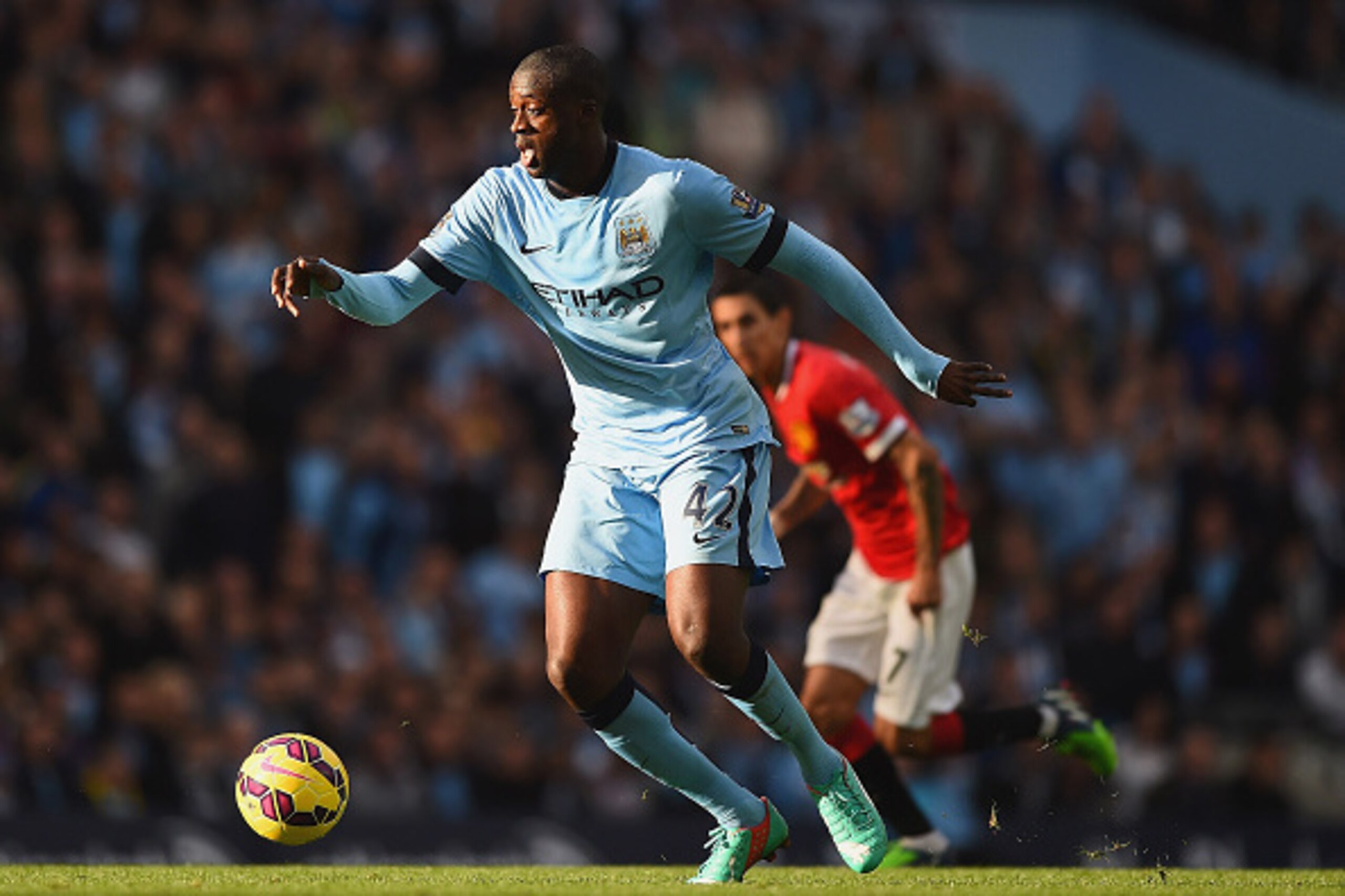 MANCHESTER, ENGLAND - NOVEMBER 02: Yaya Toure of Manchester City on the ball during the Barclays Premier League match between Manchester City and Manchester United at Etihad Stadium on November 2, 2014 in Manchester, England.  (Photo by Laurence Griffiths