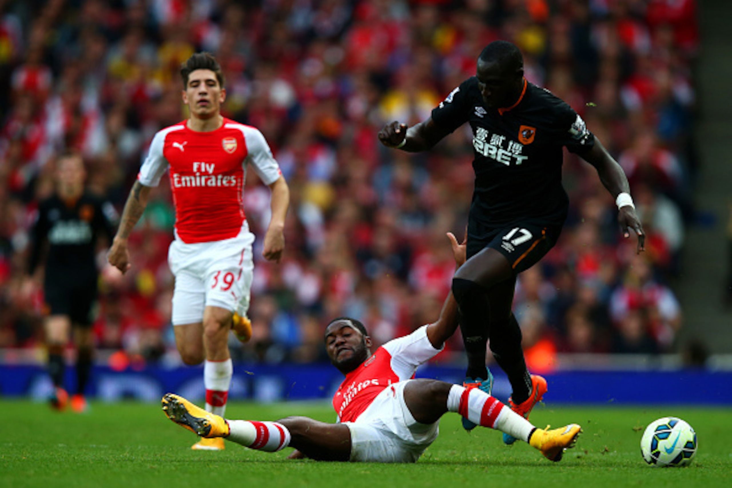 LONDON, ENGLAND - OCTOBER 18:  Joel Campbell of Arsenal challenges Mohamed Diame of Hull City during the Barclays Premier League match between Arsenal and Hull City at Emirates Stadium on October 18, 2014 in London, England.  (Photo by Clive Rose/Getty Im