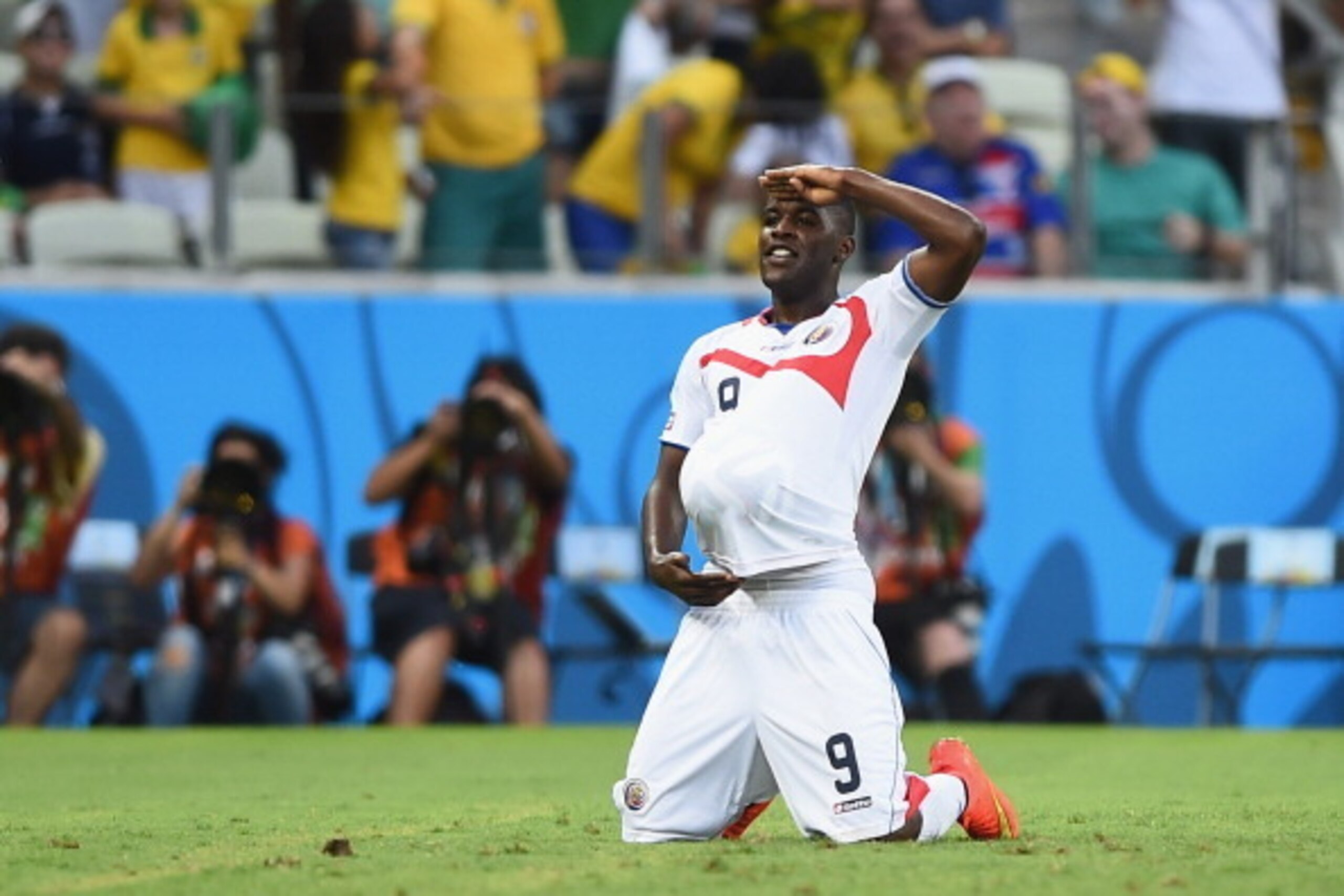 FORTALEZA, BRAZIL - JUNE 14: Joel Campbell of Costa Rica celebrates scoring his team's first goal with the ball under his jersey during the 2014 FIFA World Cup Brazil Group D match between Uruguay and Costa Rica at Castelao on June 14, 2014 in Fortaleza, 