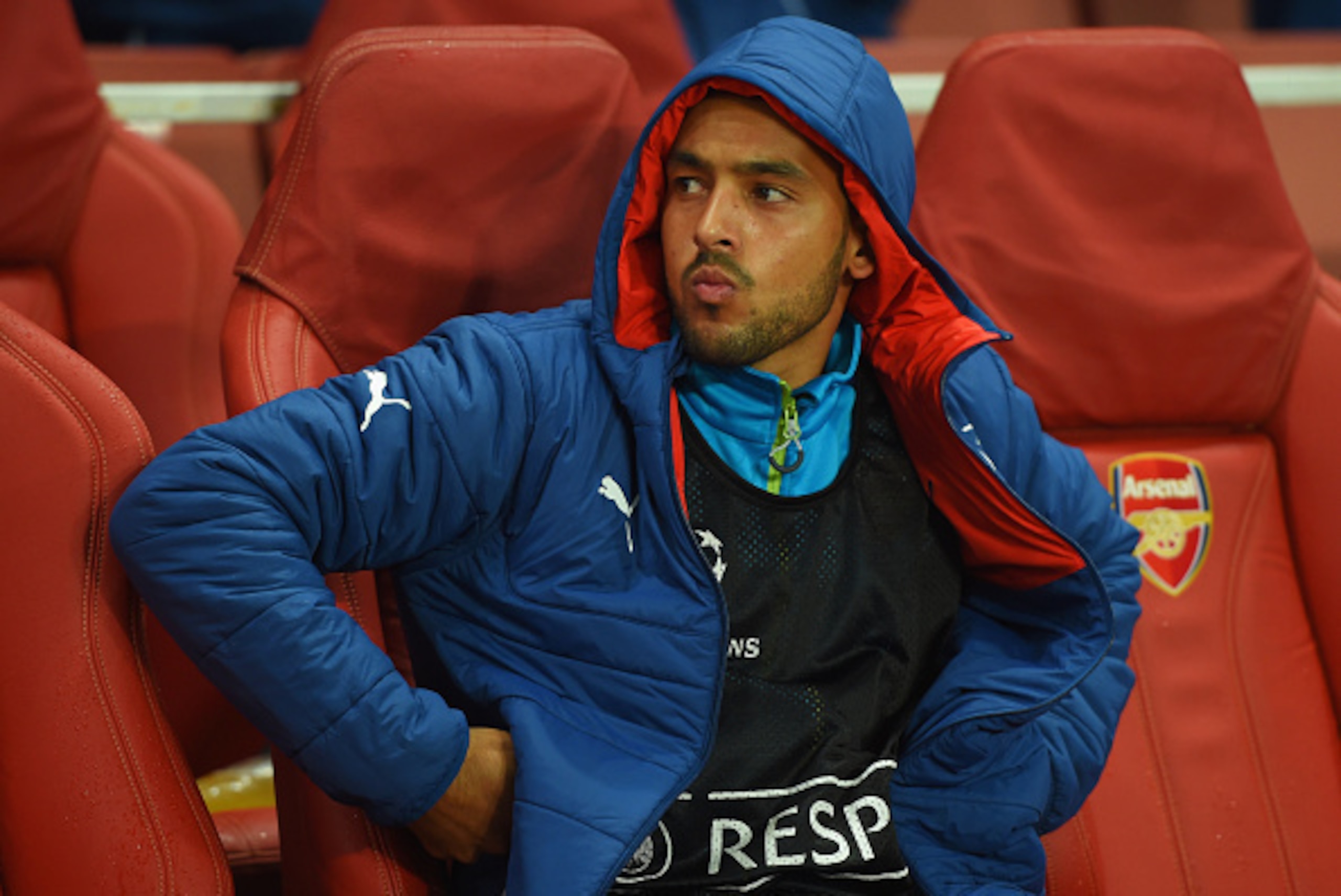 LONDON, ENGLAND - NOVEMBER 04: Substitute Theo Walcott of Arsenal looks thoughtful as he sits on the bench prior to the UEFA Champions League Group D match between Arsenal FC and RSC Anderlecht at Emirates Stadium on November 4, 2014 in London, United Ki LONDON, ENGLAND - NOVEMBER 04: Substitute Theo Walcott of Arsenal looks thoughtful as he sits on the bench prior to the UEFA Champions League Group D match between Arsenal FC and RSC Anderlecht at Emirates Stadium on November 4, 2014 in London, United Ki