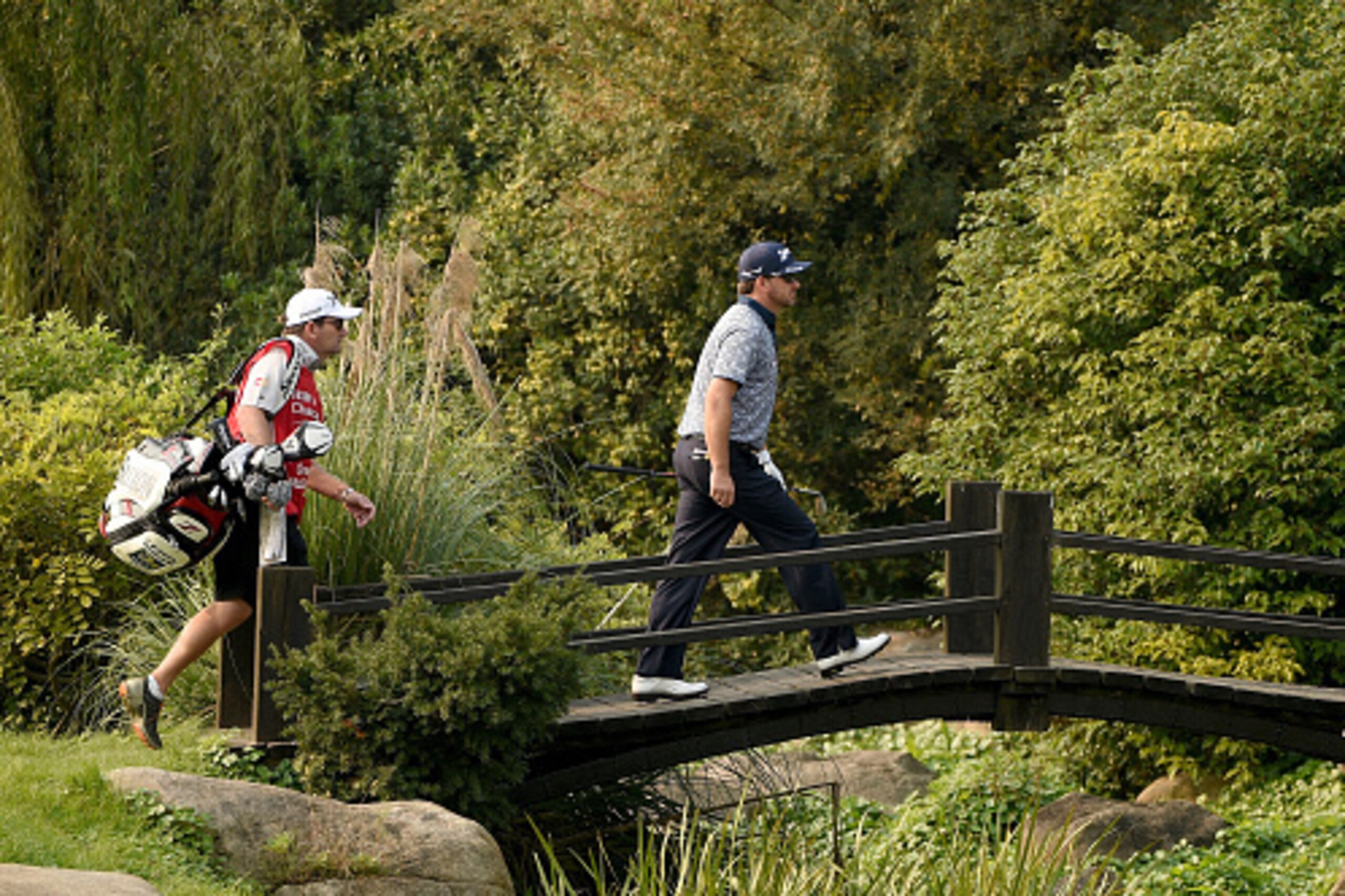 SHANGHAI, CHINA - NOVEMBER 06: Graeme McDowell of Northern Ireland makes his way on to the 8th green during the first round of the WGC - HSBC Champions at the Sheshan International Golf Club on November 6, 2014 in Shanghai, China. (Photo by Ross Kinnair SHANGHAI, CHINA - NOVEMBER 06: Graeme McDowell of Northern Ireland makes his way on to the 8th green during the first round of the WGC - HSBC Champions at the Sheshan International Golf Club on November 6, 2014 in Shanghai, China. (Photo by Ross Kinnair