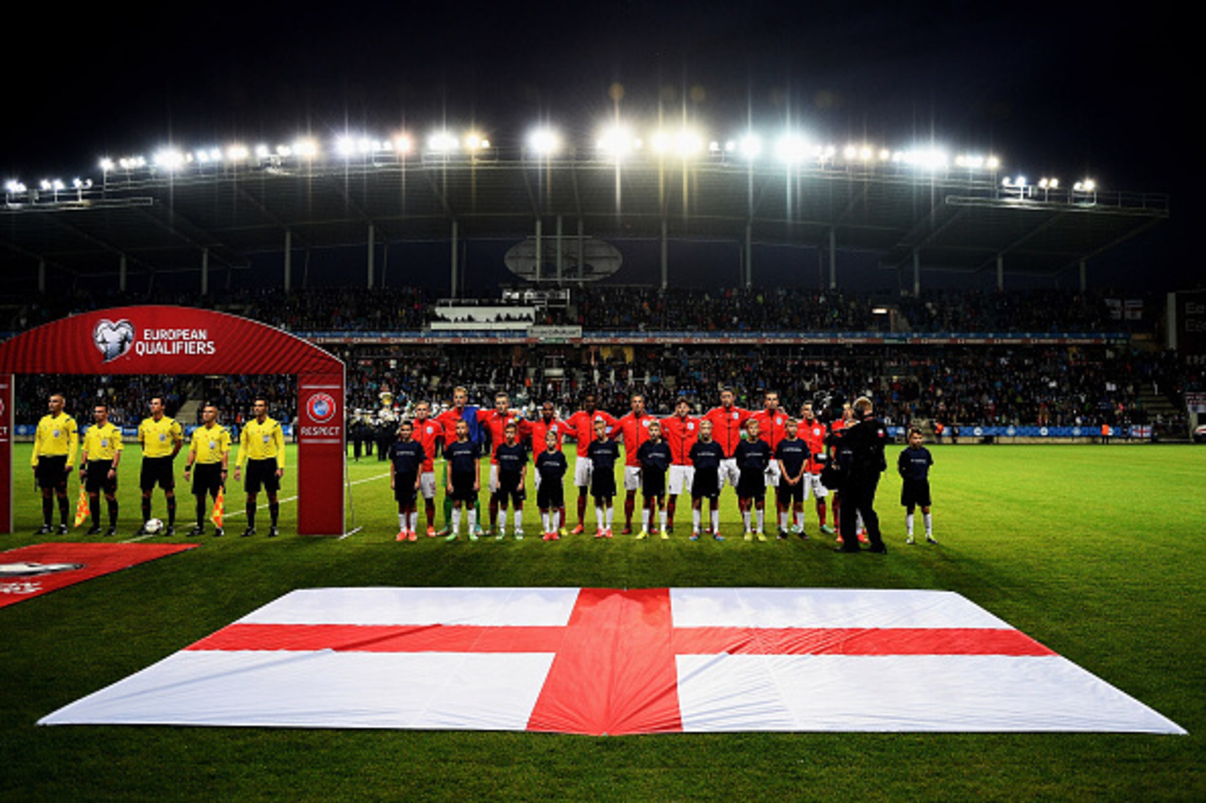 TALLINN, ESTONIA - OCTOBER 12:  The England team line up for the national anthem prior to kickoff during the EURO 2016 Qualifier match between Estonia and England at A. Le Coq Arena on October 12, 2014 in Tallinn, Estonia.  (Photo by Shaun Botterill/Getty